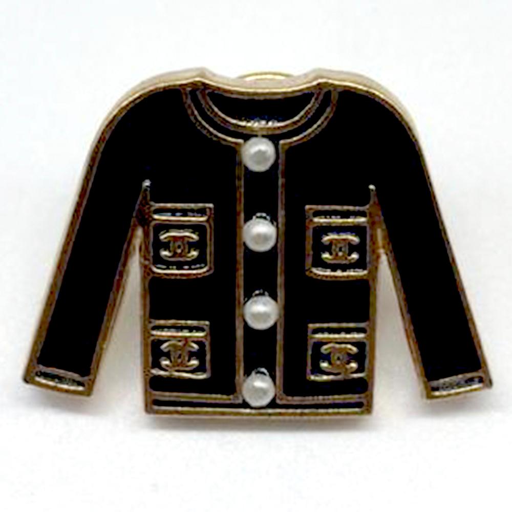 chanel brooch on jacket