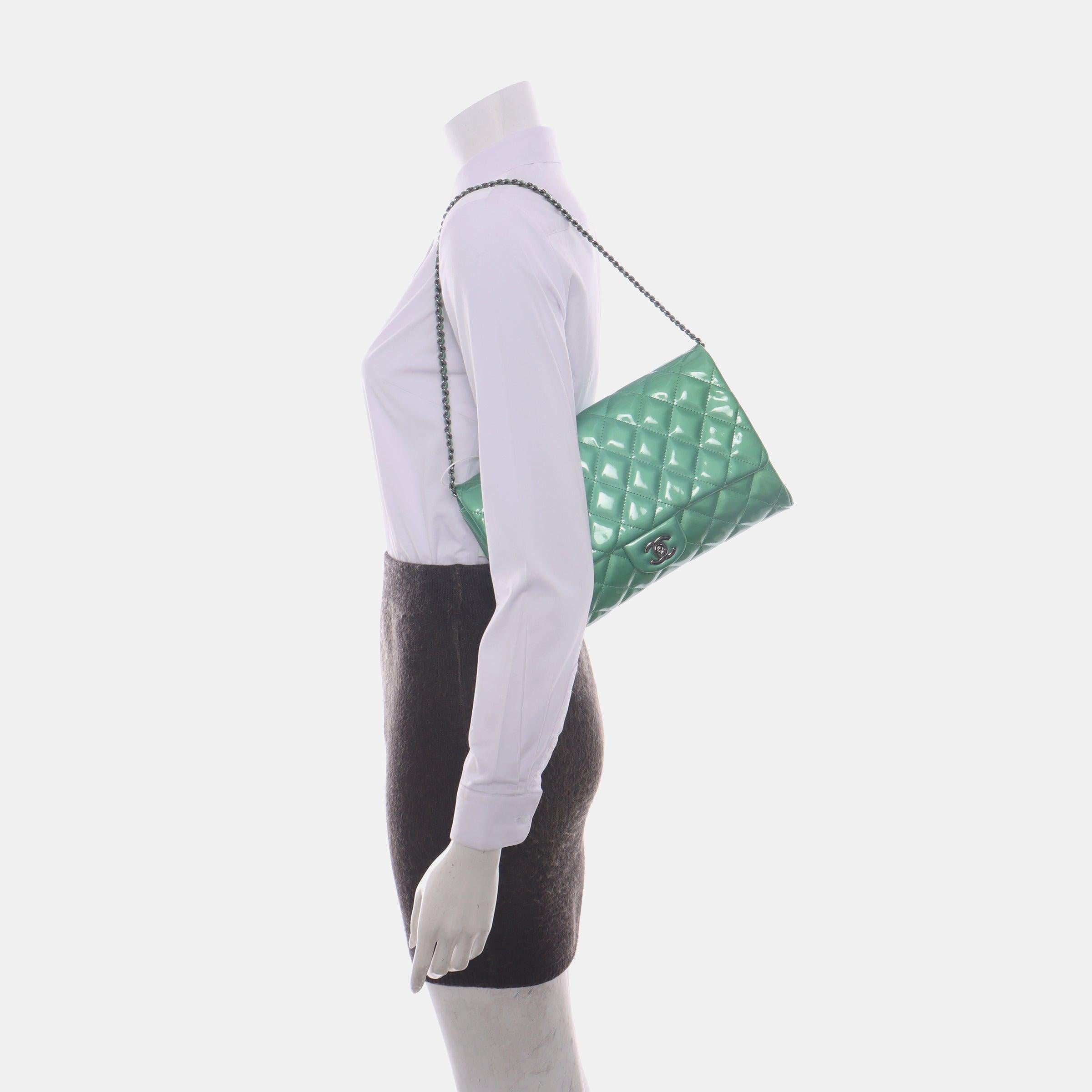 Chanel Envelope Clutch with Chains 2013 Shoulder Bag Apple Green Patent Leather
 These are professional photos of the actual bag offered by Luxbags.
 CONDITION: Very good condition with signs of use throughout.
 No yellowing of the patent leather.
