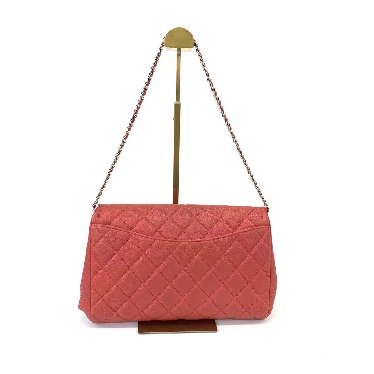 Chanel Envelope Clutch with Chains 2013 Shoulder Bag Coral Red Caviar Leather These are professional photos of the actual bag offered by Luxbags. Chanel Clutch Flap Shoulder bag in Coral Red Caviar Leather with Silver Chain. The single chain is