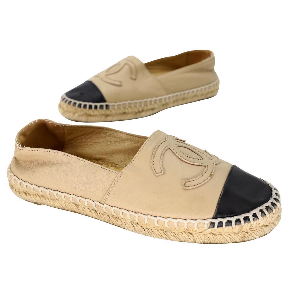 These fun Chanel Beige Leather with Cap Toe Espadrille Flats can enhance any style. These highly sought after espadrilles are a must have for any trendy fashionista! These flats include the signature woven rope single layer. Espadrille style and a