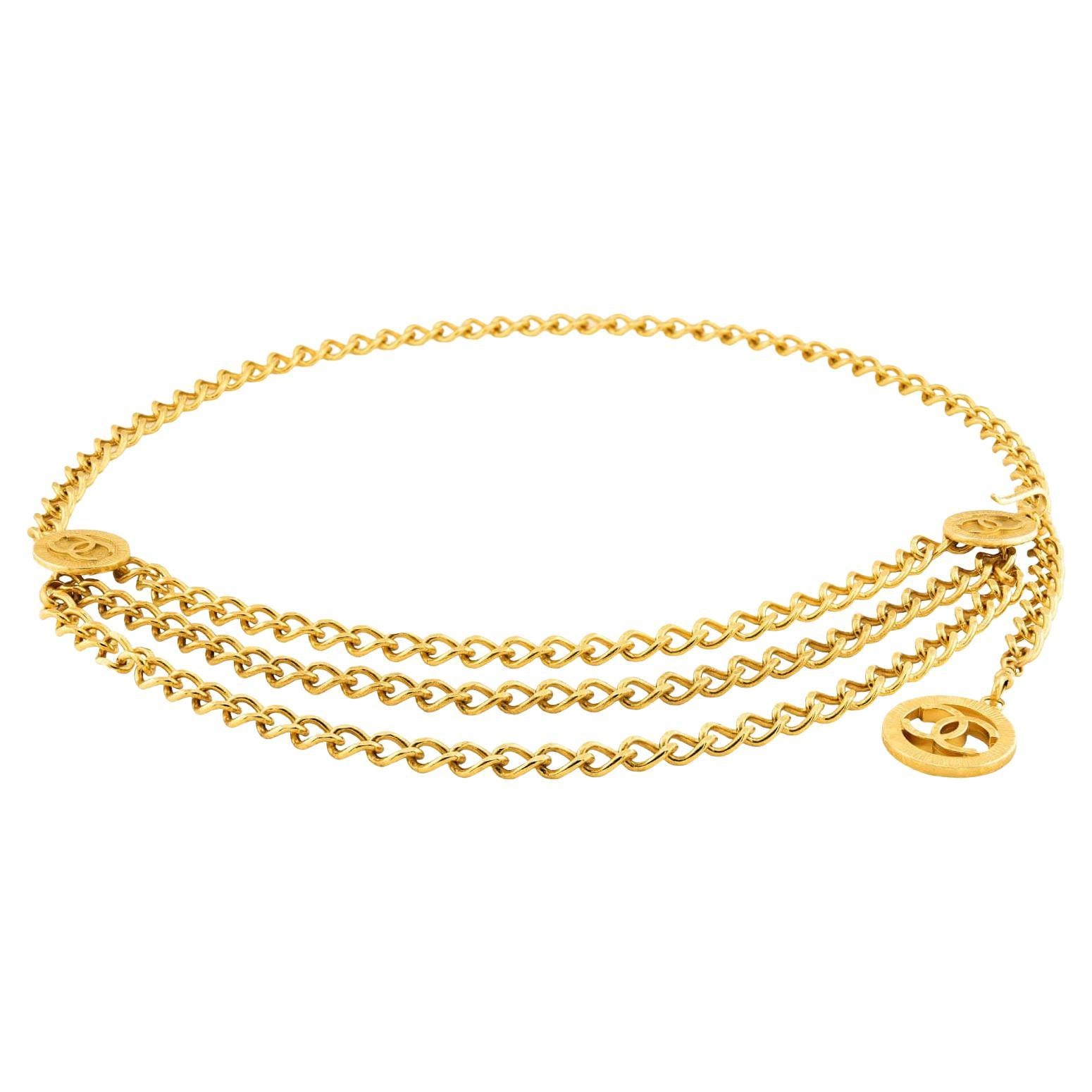 Cintura a catena Chanel Estate con placca d
oro e argento massiccio