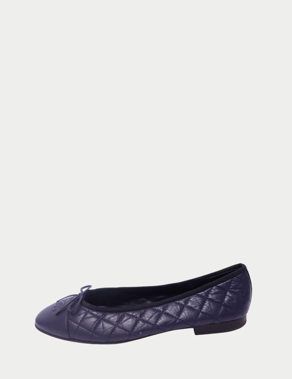 Chanel Quilted Ballerina Flats – Navy Lambskin Leather

A timeless classic redefined—these Chanel Quilted Ballerina Flats in navy lambskin are the epitome of Parisian chic. Designed with a rounded cap toe, delicate leather bow, and the iconic CC