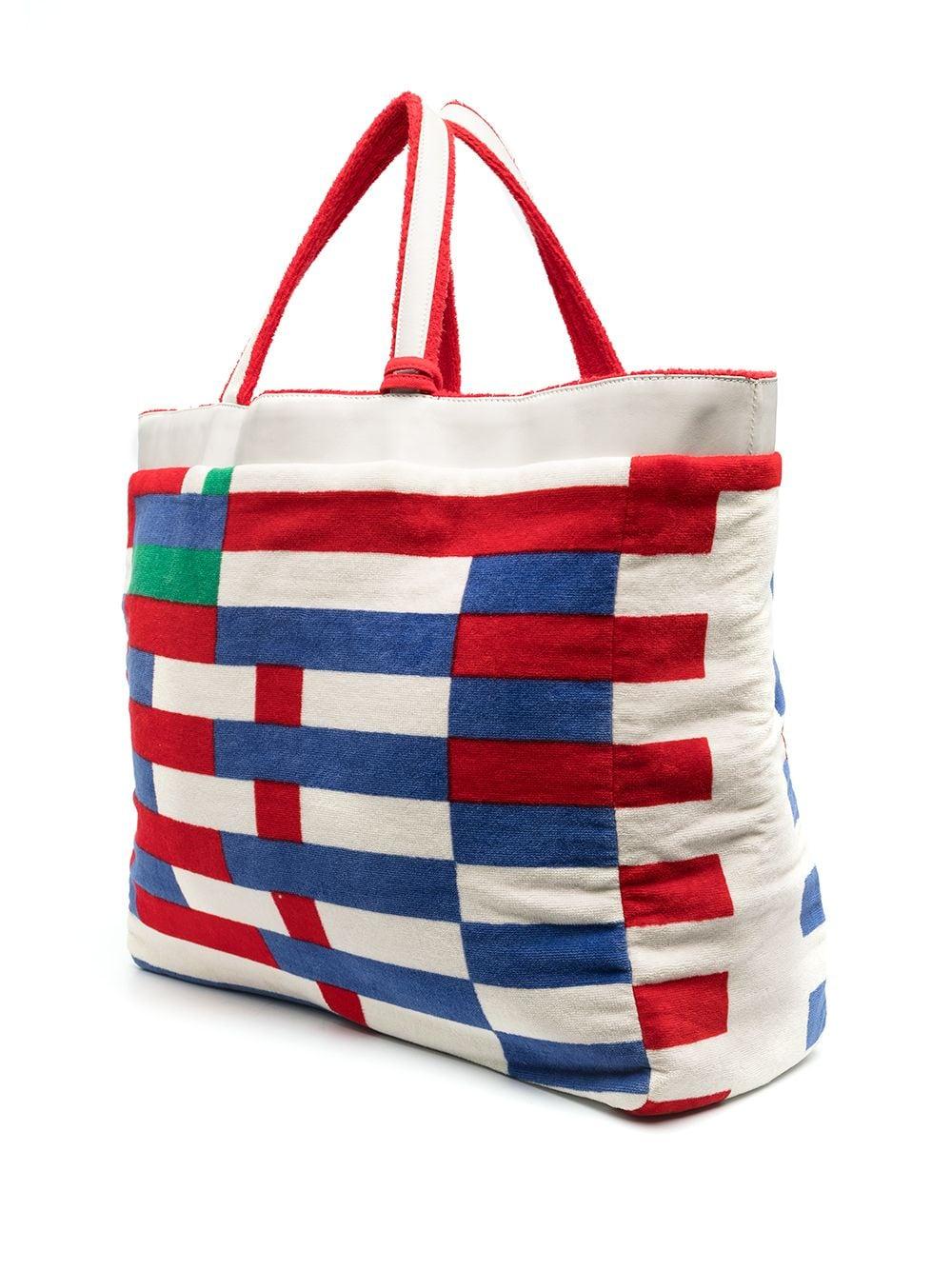 Rare Terry Chanel beach bag, with square pattern in striking primary colours. This beautiful large tote comes with a detatchable internal compartment which zips close, making it the perfect bag for day trips and visits to the beach.	

Colour: Red/