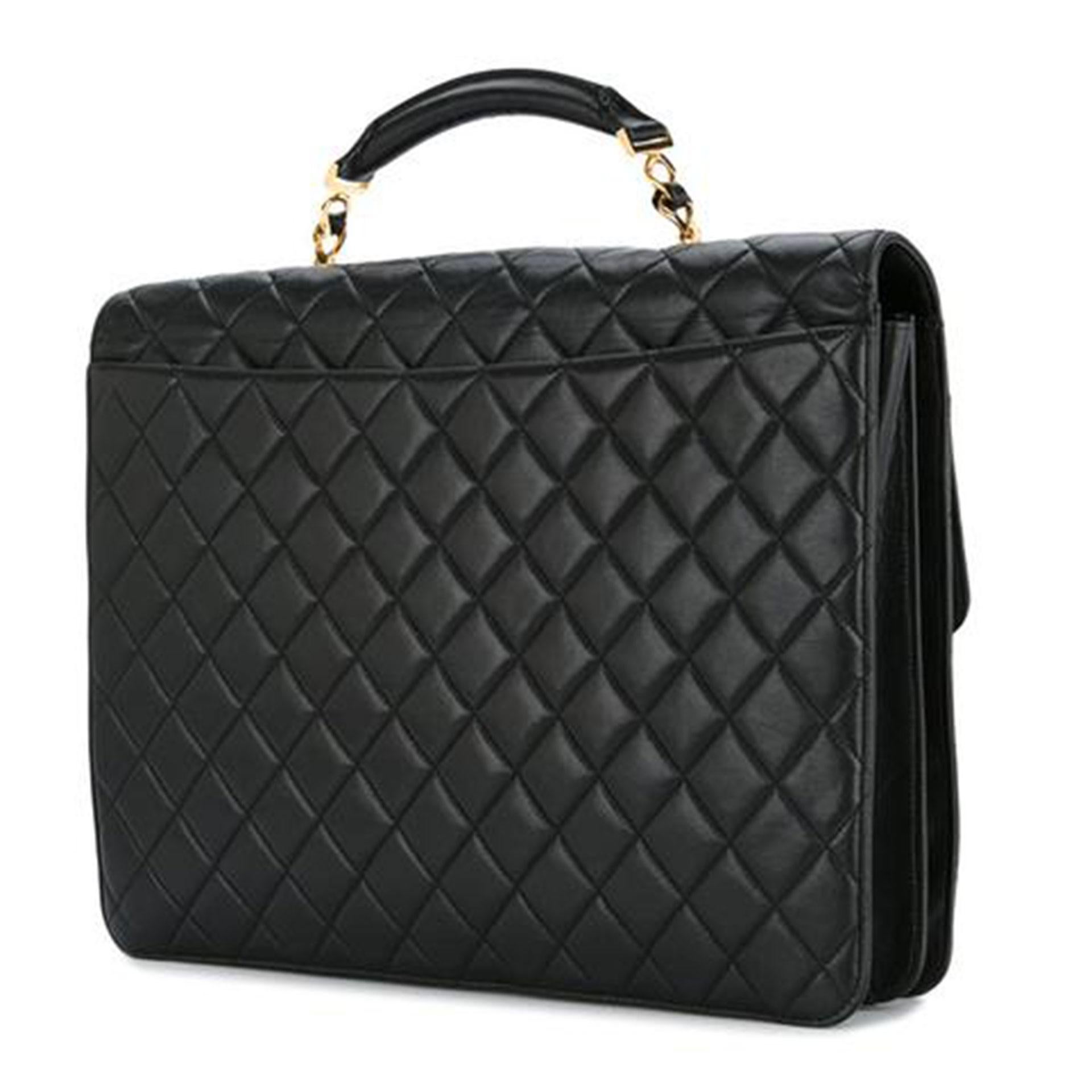 Chanel extra large quilted lambskin briefcase with gold CC clasp

1991 {VINTAGE 27 Years}
Gold hardware
Two main interior compartments
Two interior centered zippered pocket
11.8” H x 14.6” W x 4.3” D
Handle Drop 4