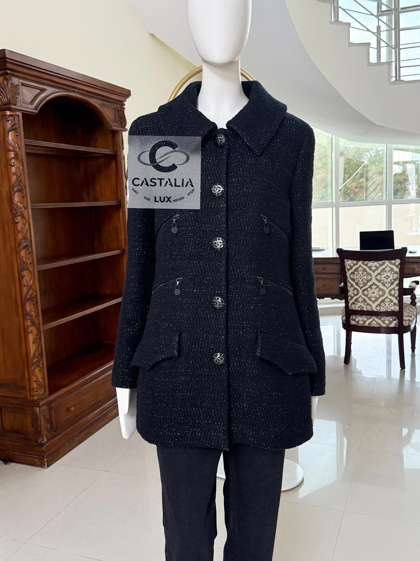 Super rare, collectible Chanel black shimmer tweed jacket with multi zipped pockets 
- CC logo buttons at front 
- multi pocket with CC logo zipper
- black silk lining with camellias
Size mark 38 FR / Condition: never worn