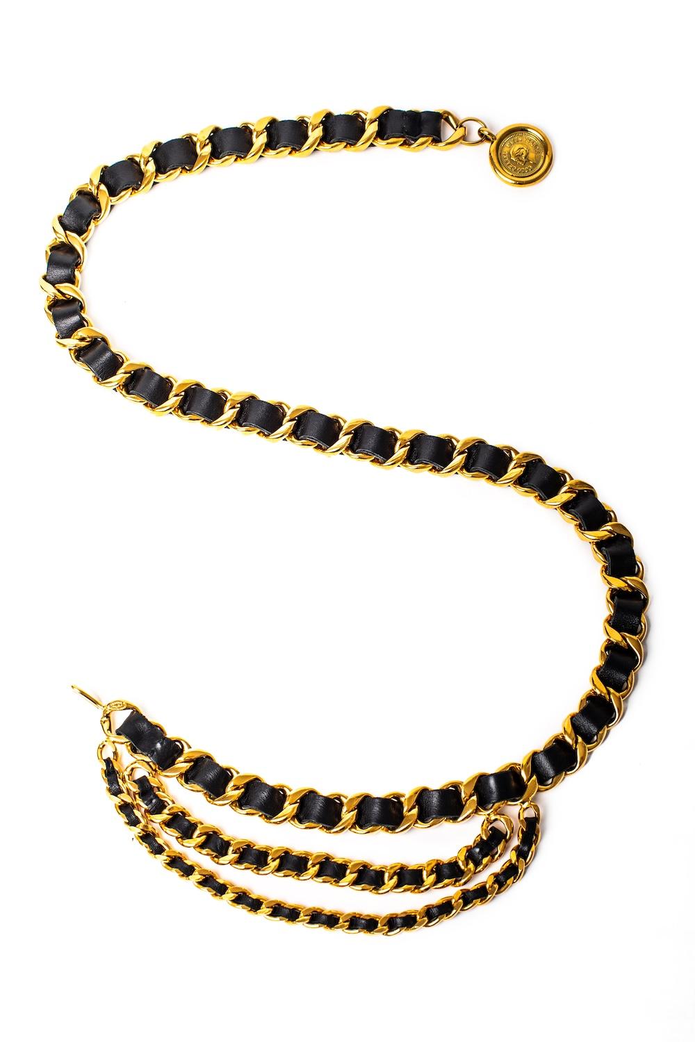 Originally appearing on the runway in the F/W 1991 'Hip Hop' RTW collection, this rare & collectible Chanel belt features an extra chunky woven leather chain with two woven leather chains of graduating size suspended from one side and a circular CC
