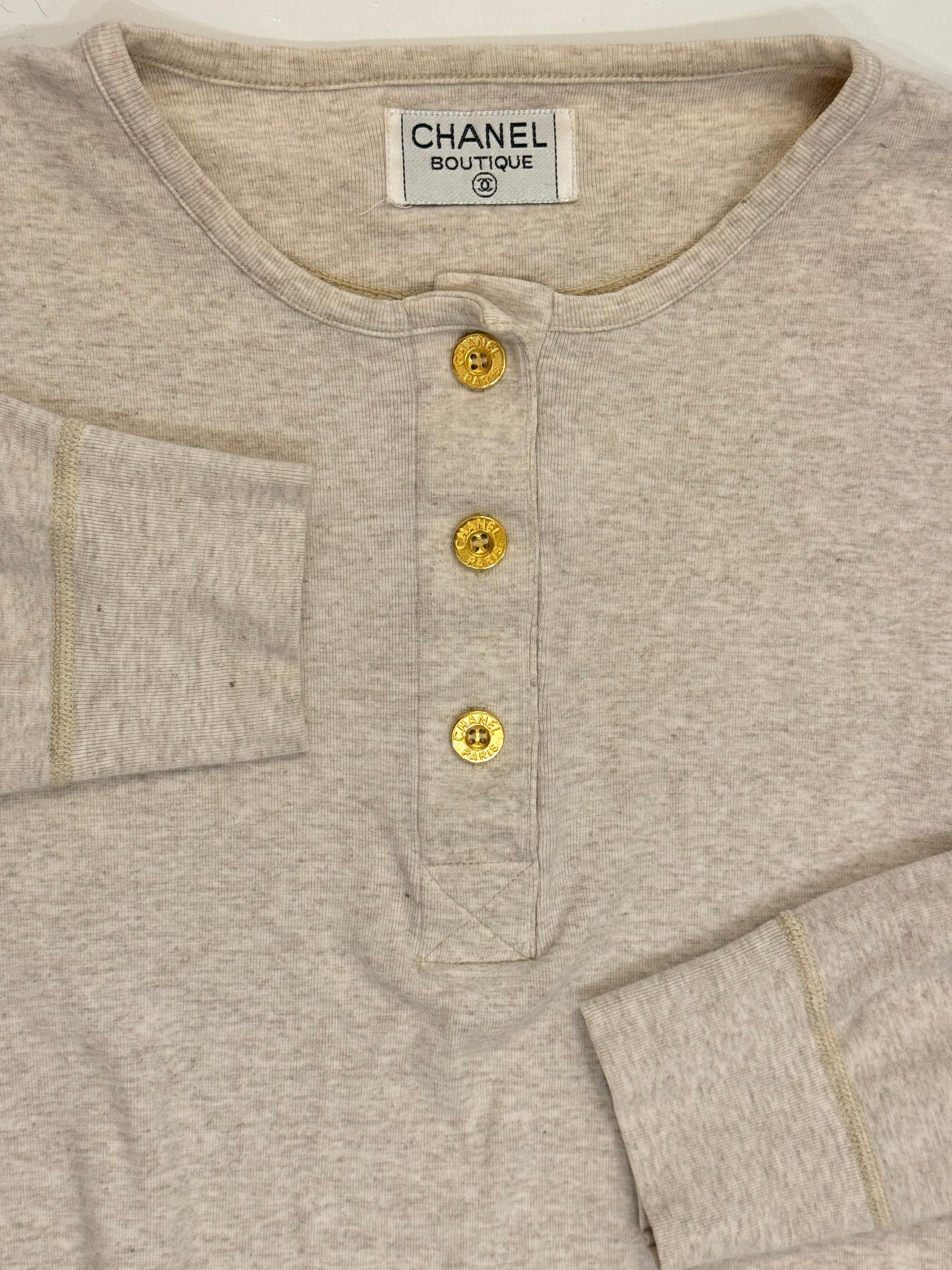 Rare Chanel Fall Winter 1993 grey cotton sweatshirt as seen on Claudia Schiffer and Estelle Lefebure, 24k gold plated Chanel Paris buttons, no size tag, bust 47 up to 60 inches, shoulders 20.5 up to 25, Length 28 