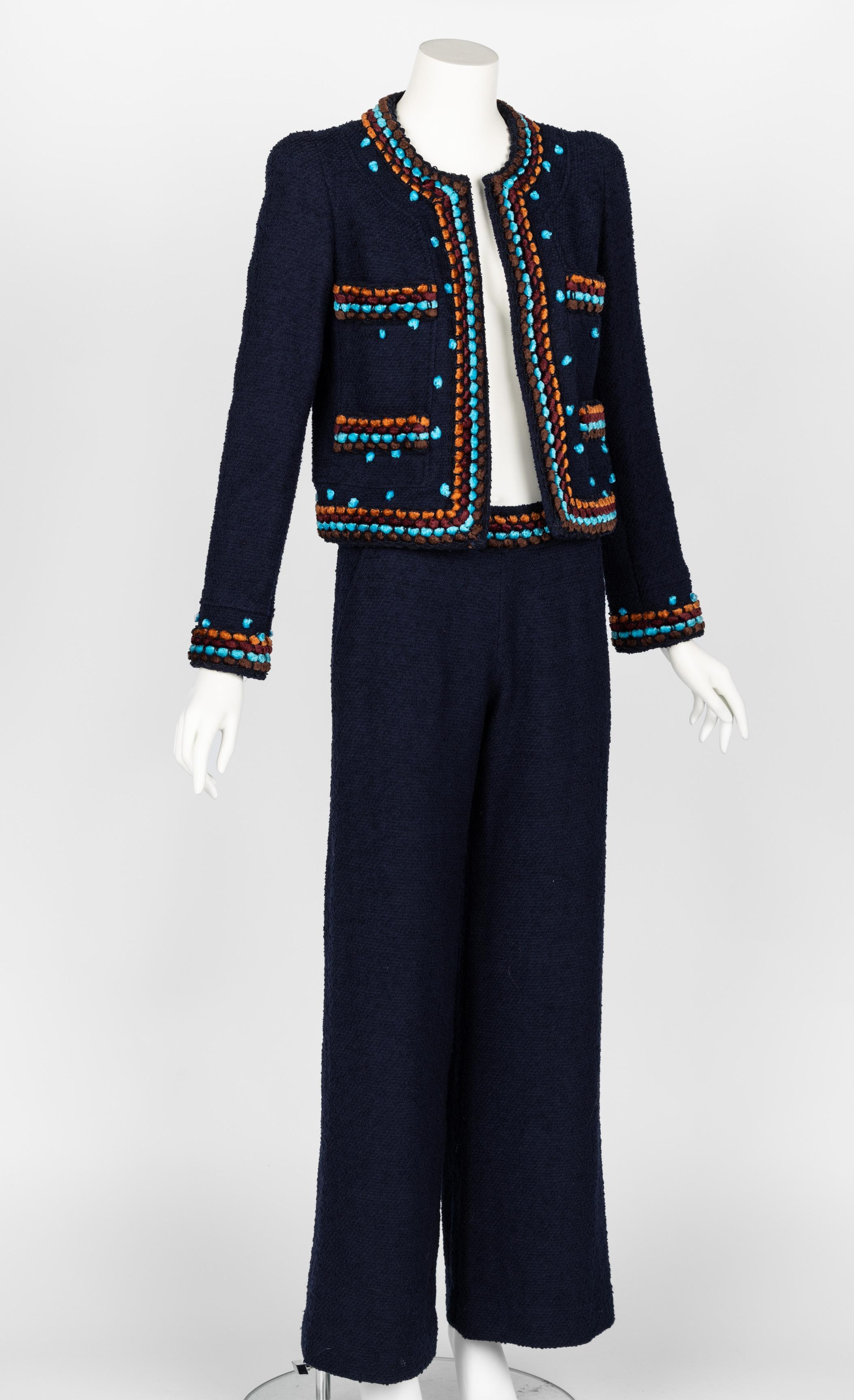 Chanel runway fall 1997 jacket and pants set.
Cropped jacket with chenille trim in brown, burgundy, orange, and turquoise.
Lightly padded shoulders, gunmetal chain weight at the interior hem of the jacket.
Jacket fully lined in CC navy silk logo