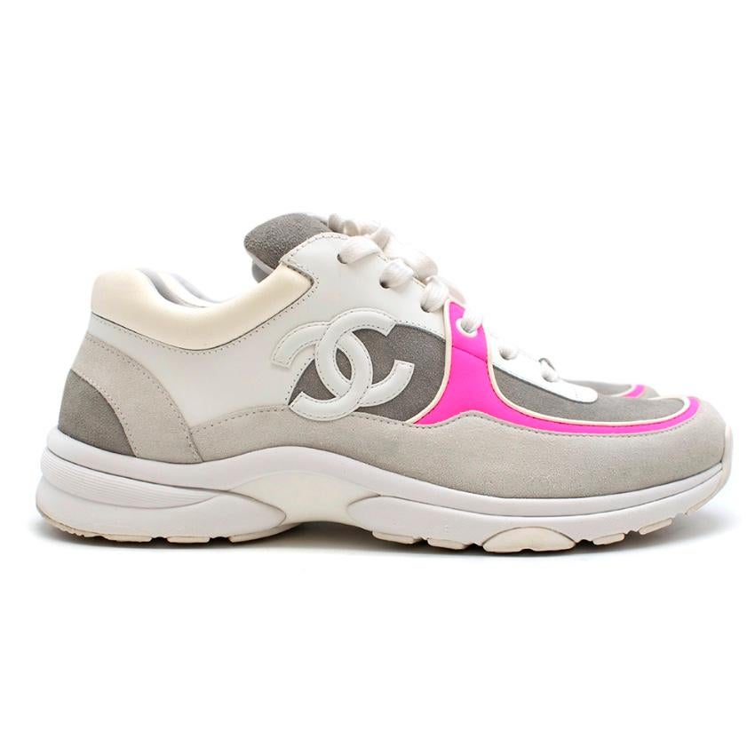 Chanel Fabric and Suede CalfSkin Sneakers with Neon Pink

- Round toe 
- CC detail at Lace and Outer side 
- Lace-Up front 
- Neon Pink Contrast Trim 
- Suede and Leather Outer 

Made in Italy 

Please note, these items are pre-owned and may show
