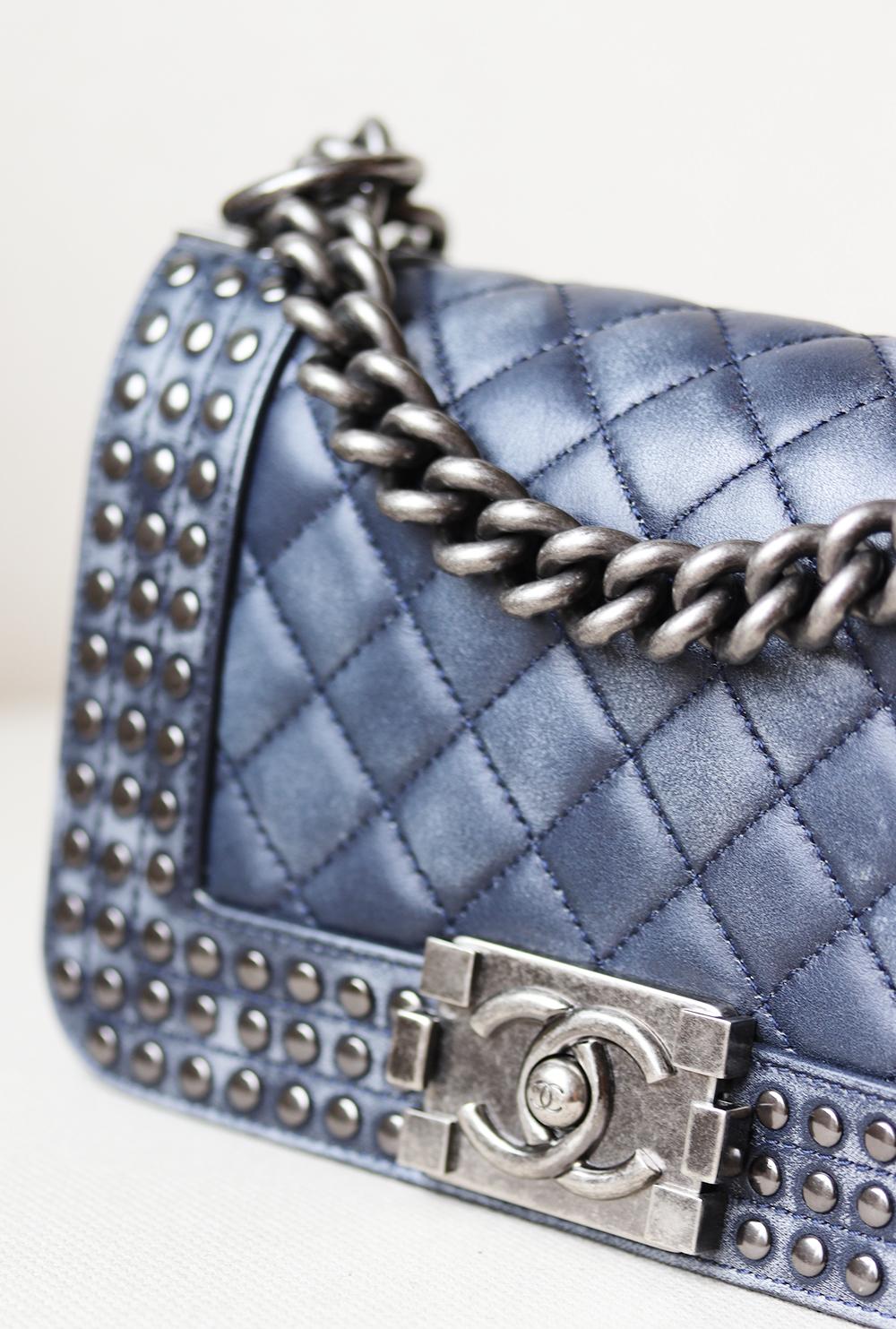 Chanel Small Boy Faded Leather Studded Flap Bag from Chanel Paris-Dallas 2014 collection has been hand-finished by skilled artisans in the label's workshop.
Boasting soft faded blue quilted lambskin-leather exterior and studded detail along the
