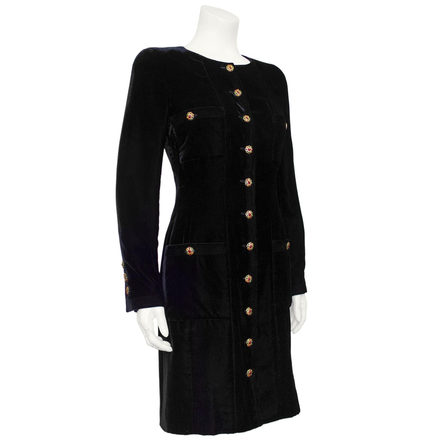 Super chic and timeless Chanel dress from the fall 1986 collection. Jet black velvet with 21 absolutely stunning multicoloured poured glass gripoix buttons. Crew neckline with long sleeves and patch pockets at the bust and hips. The perfect