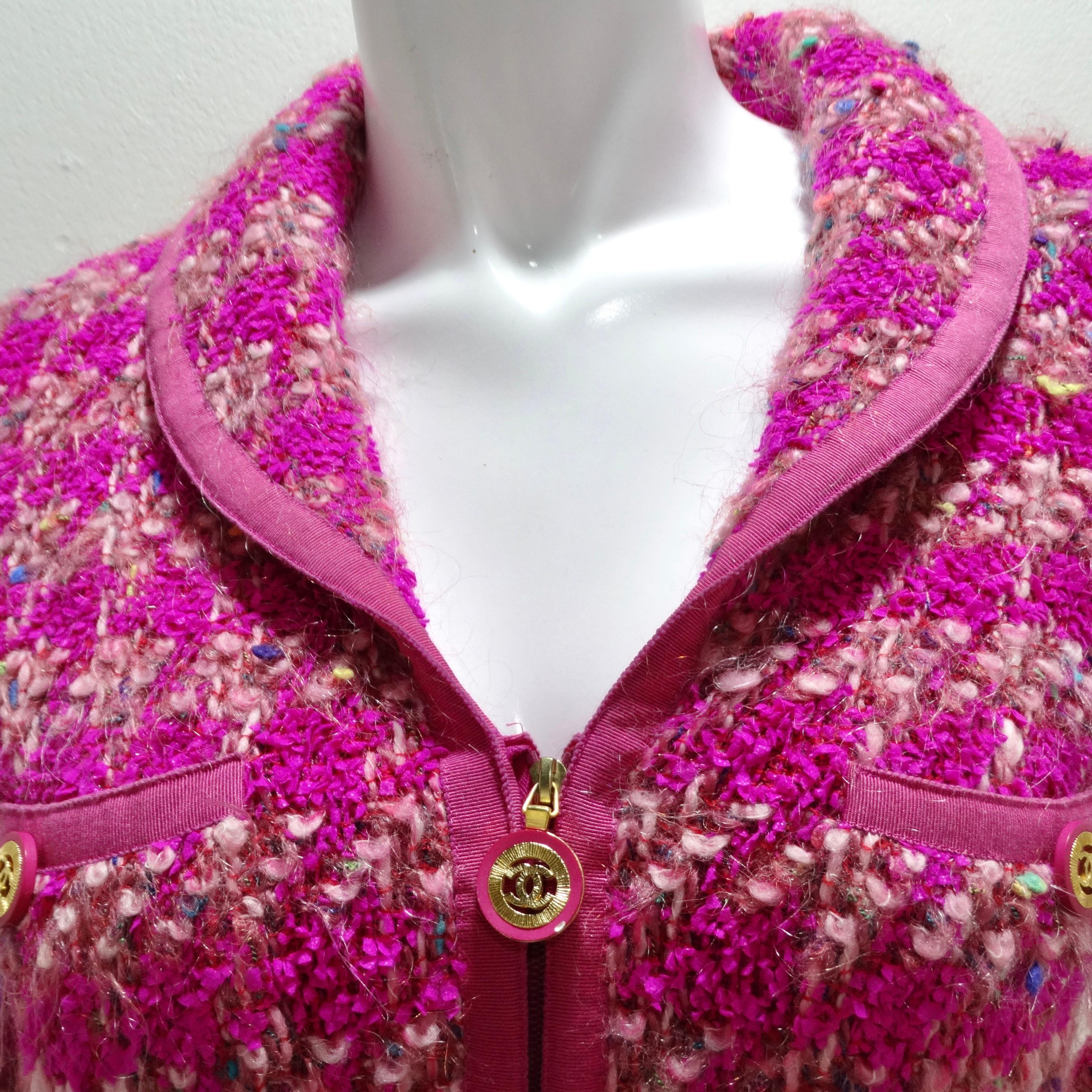 Step into the epitome of glamour with the Chanel Fall 1991 Hot Pink Tweed Jacket, a masterpiece of luxury and playfulness. This exquisite zip-up jacket combines timeless sophistication with a burst of fun. Revel in the details, from the chic collar
