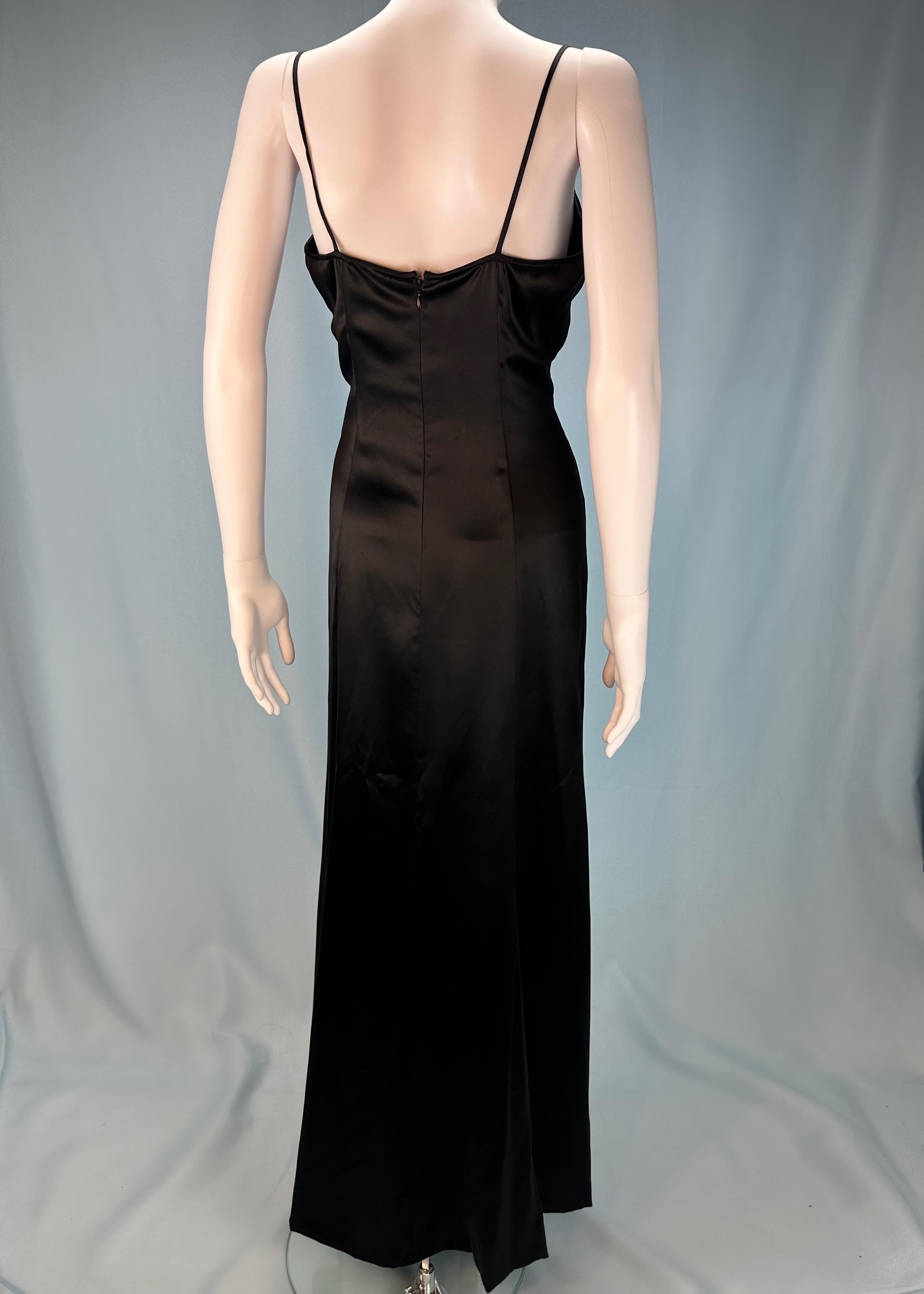 Vintage Chanel
by Karl Lagerfeld
Fall 1995
Black silk satin full length dress
Slightly flared A line skirt
Fully lined
Zip up back
100% silk 
Size EU 42 / UK 14 / US 10 
Clipped back on model in images  

Measurements - 
Chest 35” 
Waist 30.25”
Hips
