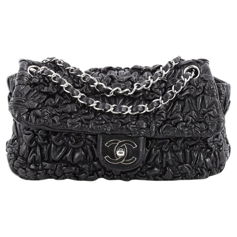 Chanel Black Ruched Wrinkled Leather Medium Classic Flap Bag 

Fall 2007 

Silver hardware
Classic interwoven leather shoulder strap
Black ruched wrinkled leather 
Silver CC turn-lock closure 
Black nylon lining
Single interior zippered pocket at