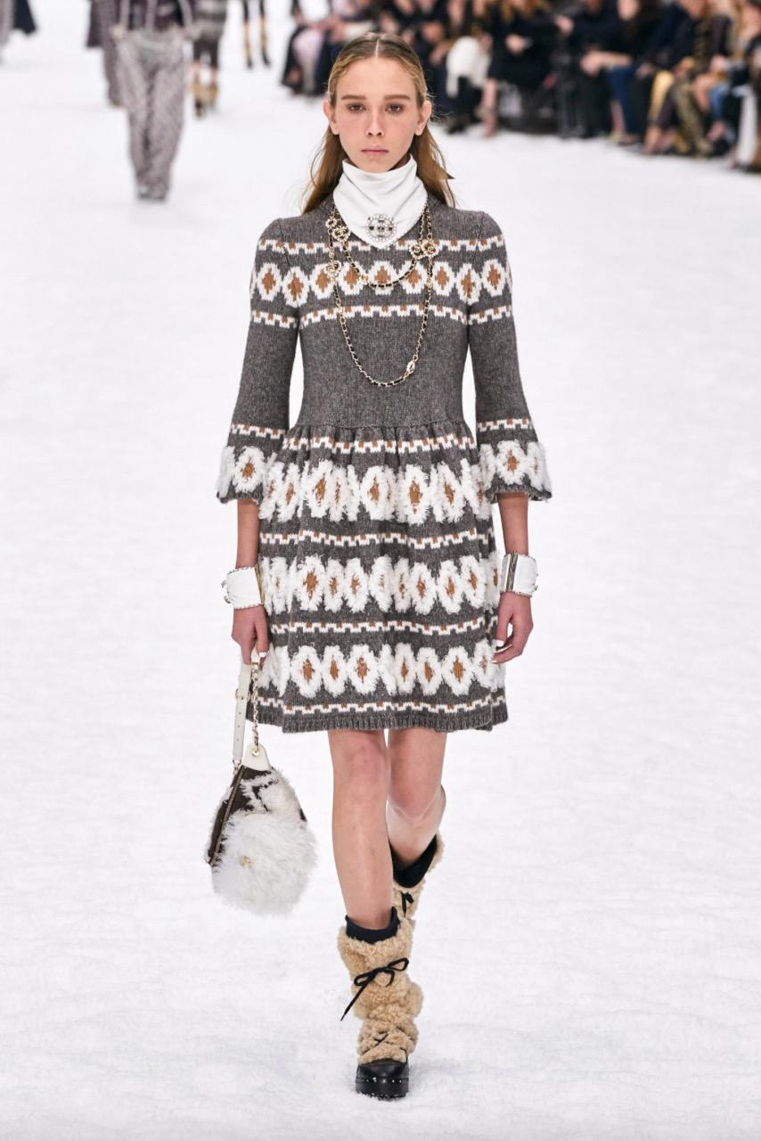 The most wanted knit dress from the Chanel Fall 2019 collection. The last show by Karl Lagerfeld for Chanel! Designed in grey wool, yack and cashmere knit with beige and white fair isle motives, the sweater dress also includes unique wooden gripoix