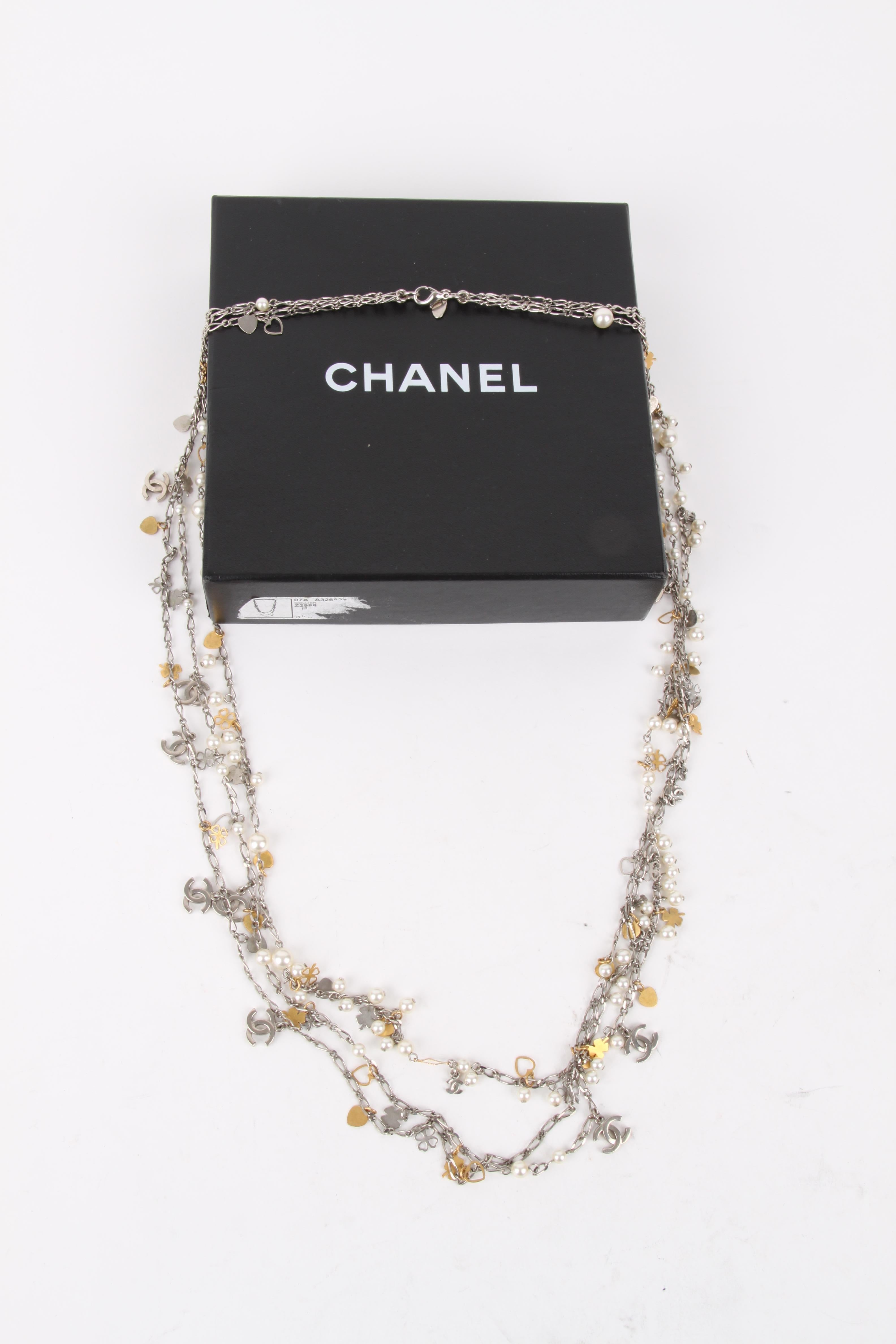 Chanel Fall/Winter 2007 (07A) Silver Gold Multi-Strand Chain Hearts Clover Faux Pearl CC Logo Necklace

Chanel Fall/Winter 2007 (07A) Silver Gold Multi-Strand Chain Hearts Clover Faux Pearl CC Logo Necklace.

This belt features a lux embellished