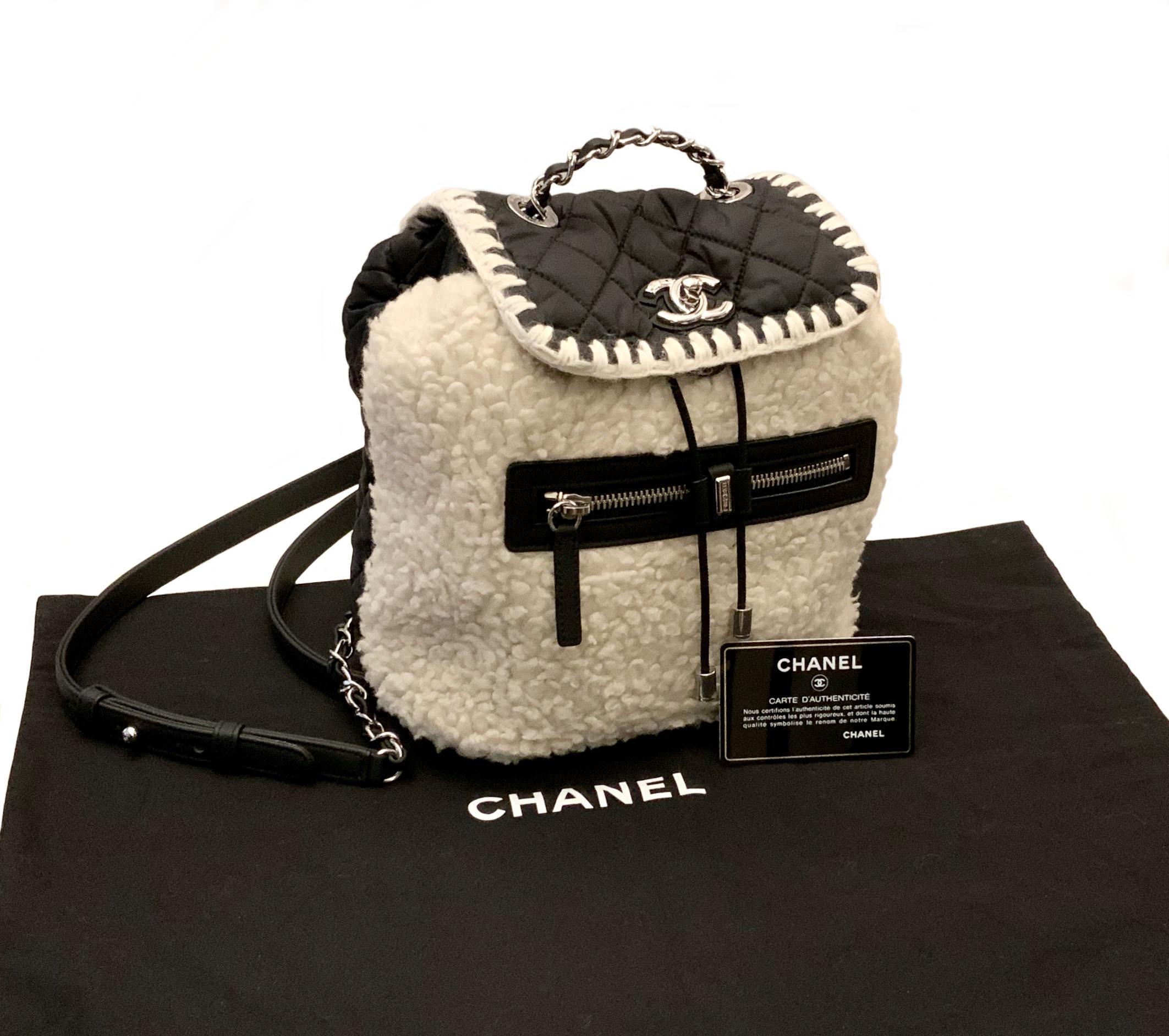 This pre-owned Chanel backpack from the Coco Neige Collection is a fashion piece for the winter. 
It is beautifully crafted in soft and smooth diamond-quilted nylon in black with the front exterior in shearling.
It features a facing external zipped