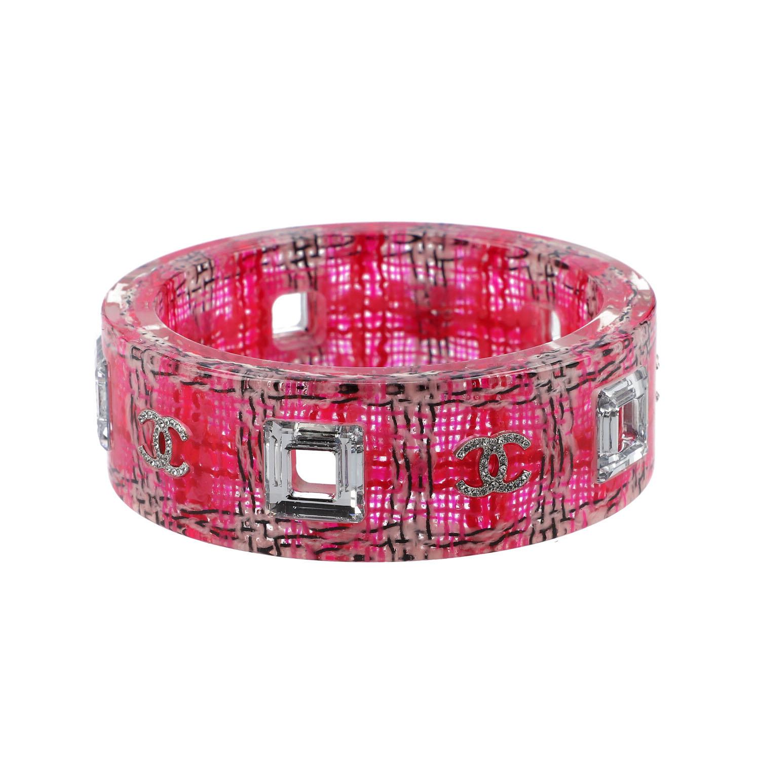 Slightly transparent band with a tweed insert in pink with a subtle checked pattern. Rhinestones and CC logo decor, decorative cut-outs. Very good receipt. With box and copy of the invoice. Diameter 6.5cm.

 CHANEL fashion jewelery bangle, coll.