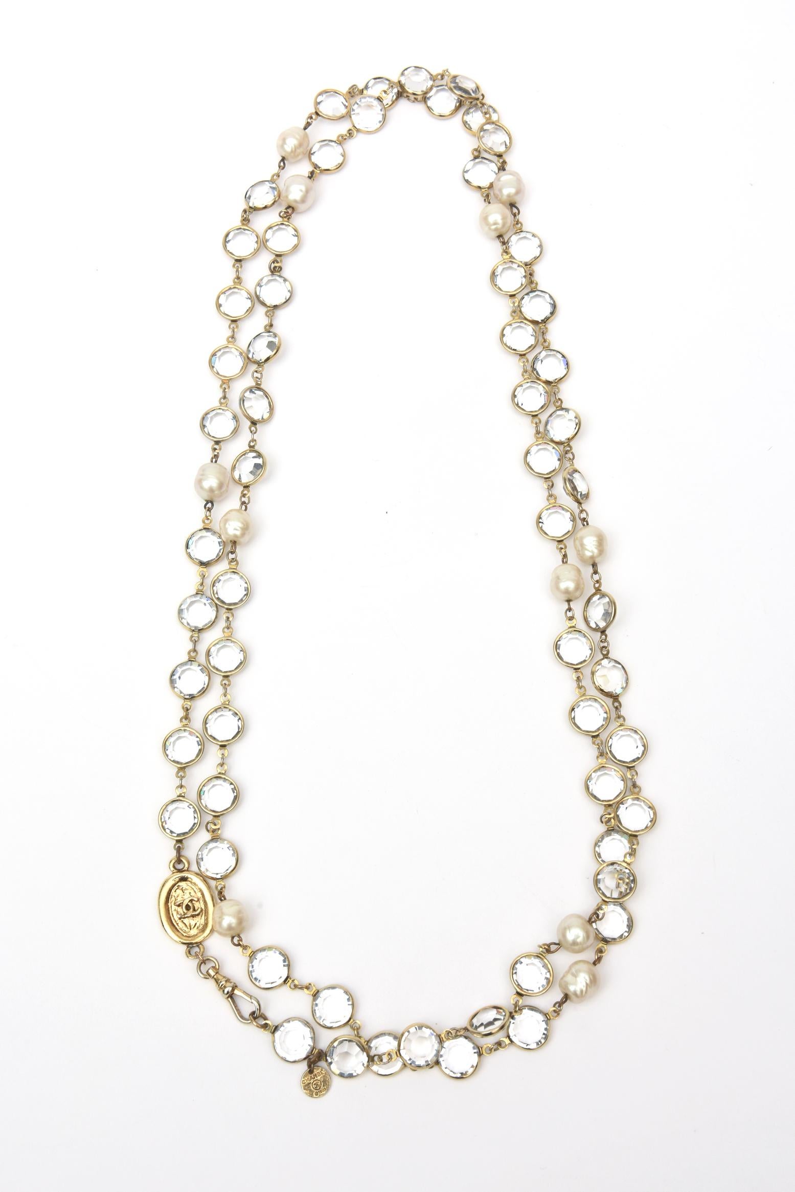 This versatile and classic signed vintage Chanel faux pearl and bevel set crystal long necklace can be wrapped twice over and even three times to make more of a wrap choker necklace. It can also be staggered at different lengths when wrapped twice