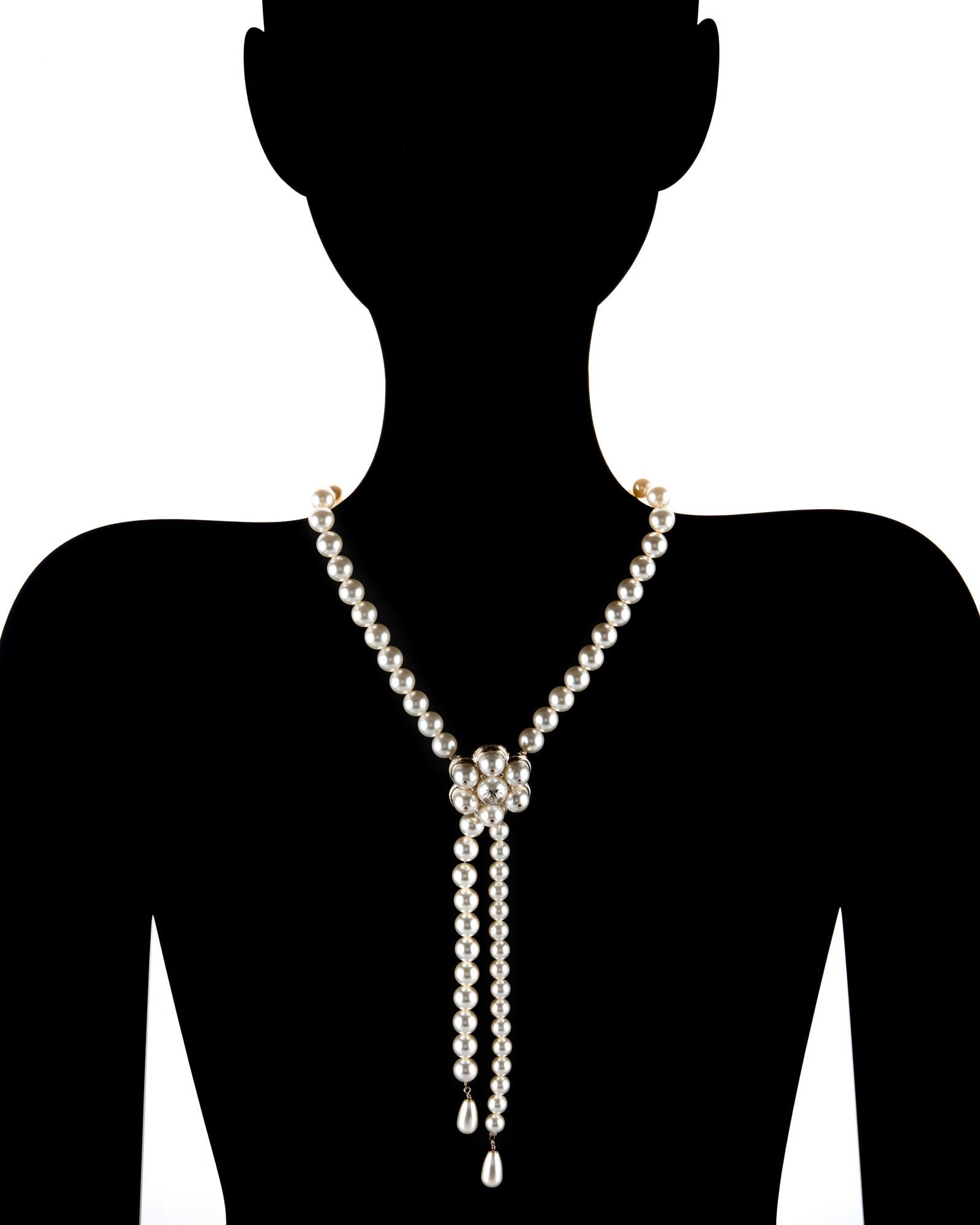 Stylish Chanel faux pearl choker drop necklace crafted in light yellow gold tone, circa 2015 

Faux pearls graduate in size from 8mm to 10mm. Two tear drop faux pearls measure 15mm x 9mm. 

The necklace dates to 2015. The necklace measures 15 inches