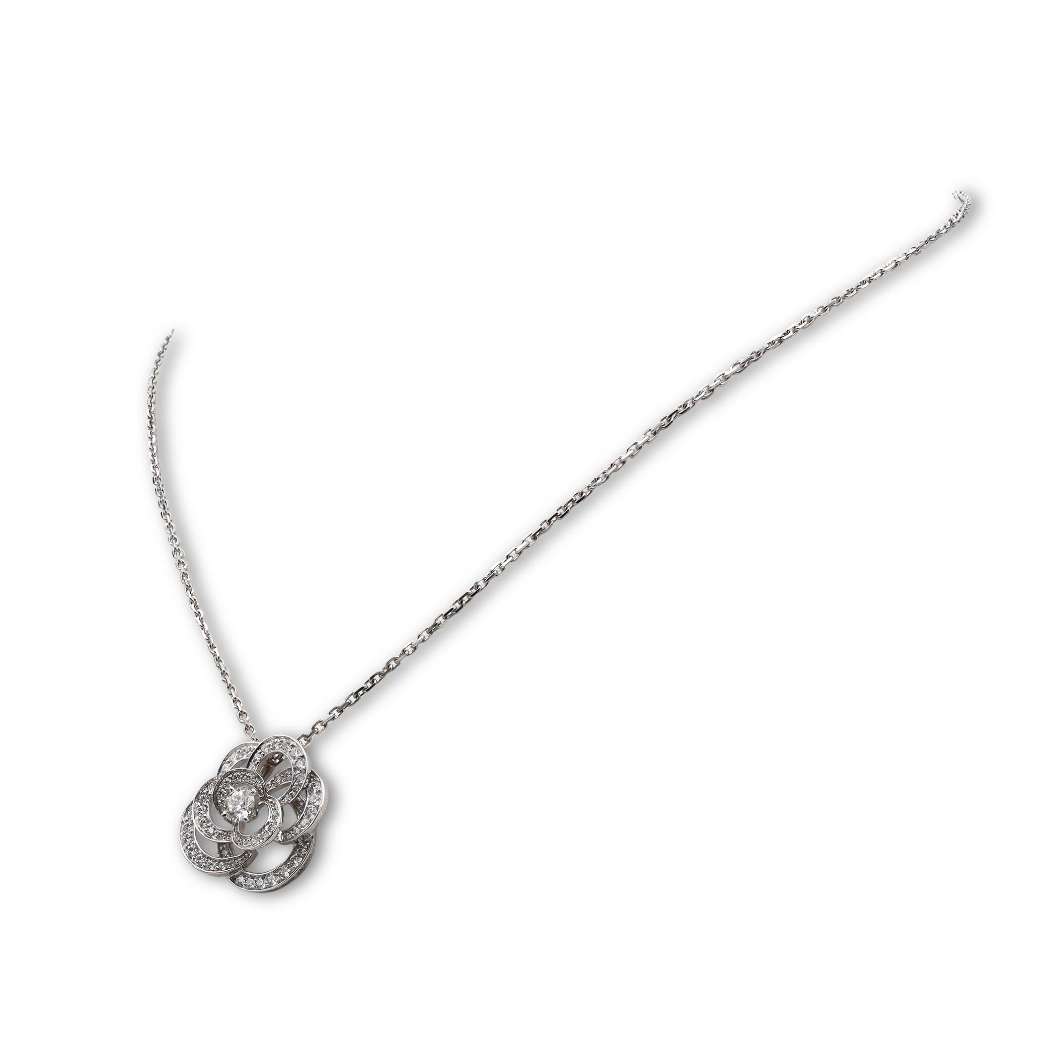 Authentic Chanel ‘Fil de Camélia’ necklace designed by Lorman Bäumer for the Maison Chanel fine jewelry collection. Crafted in 18 karat white gold and featuring a round brilliant diamond of approximately 0.25 carats at the center of the flower with