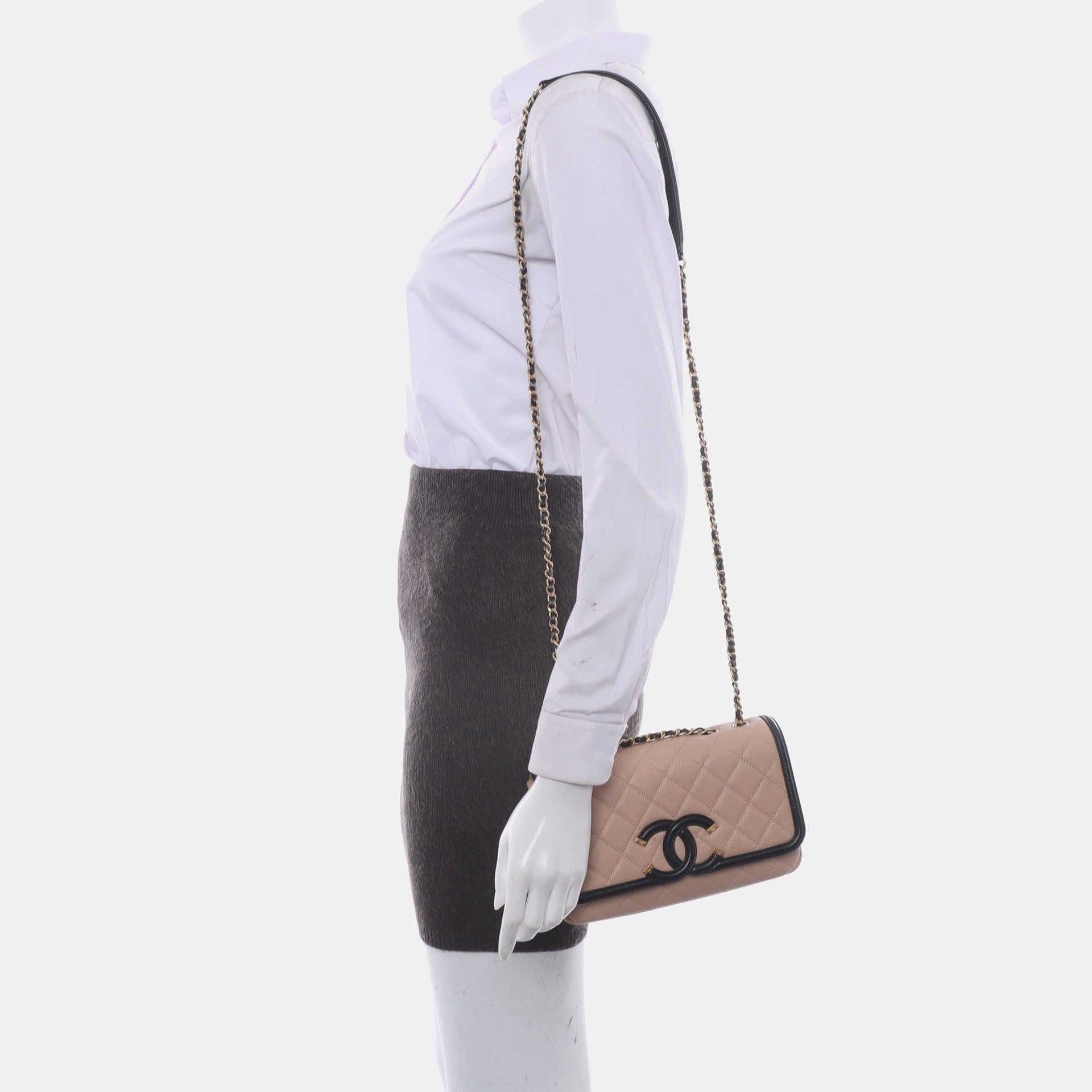 Chanel Filigree Flap Bag Caviar Leather 2017 Small Beige with Black Trim
These are professional photos of the actual bag.
  
  Chanel Filigree is a special bag that was released by the brand in 2016. One of the signature features of this collection