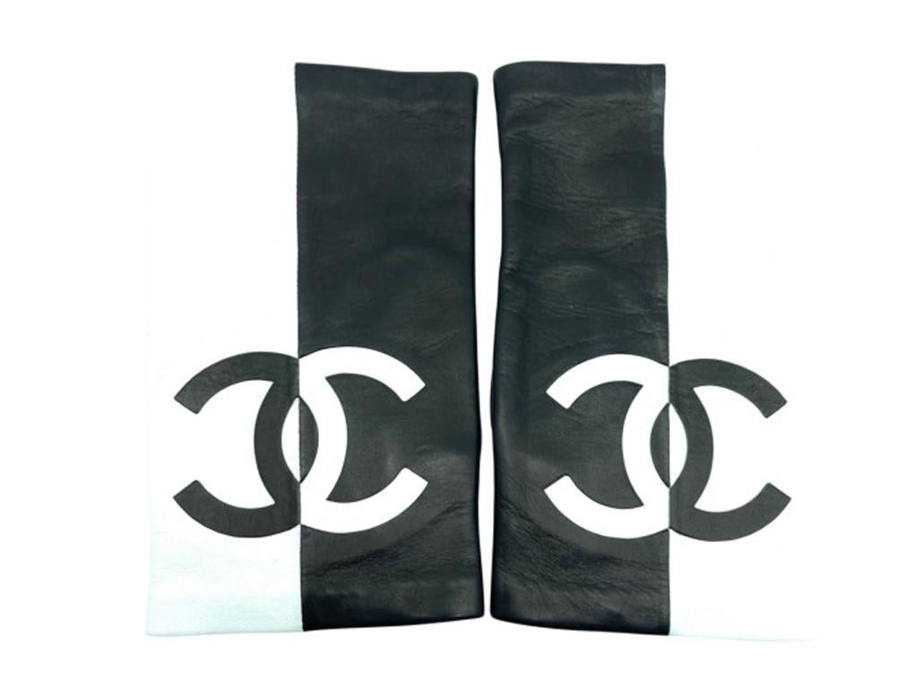 These beautiful fingerless gloves by Chanel are just wonderful.  Purchased and stored – never used. These gloves have a chic, timeless style only from Chanel.

BRAND	
Chanel

FEATURES	
Made in France, Black and White