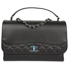 CHANEL Flap Bag in Black Smooth and Quilted Leather