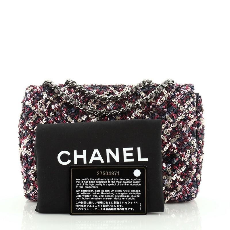 This Chanel Flap Bag Sequins Mini, crafted from purple and multicolor sequins, features woven-in leather chain strap and gunmetal-tone hardware. Its CC turn-lock closure opens to a purple satin interior with slip pocket. Hologram sticker reads:
