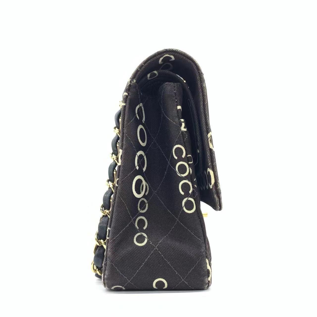 Chanel Classic Flap Diamond Stitch 2002 Black Denim with Coco Logo Prints 24k Gold Hardware
These are professional photos of the actual bag.
  This charming Vintage Chanel Denim Shoulder Bag is a stylish mix of classy and casual. Its black denim