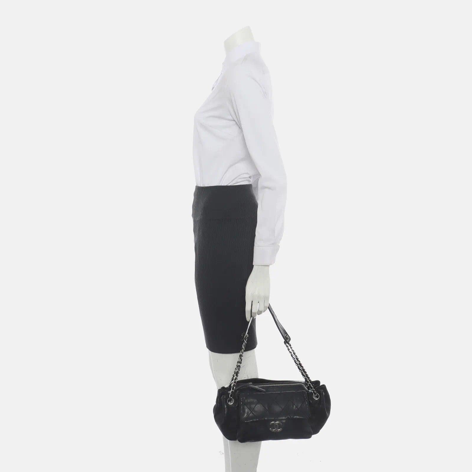 Chanel Flap Pocket Accordion Camera Bag 2005-2006 Lambskin Leather Shoulder Bag These are professional photos of the actual bag. This exquisite shoulder bag from Chanel features supple lambskin leather and sleek silver-tone hardware. Boasting a