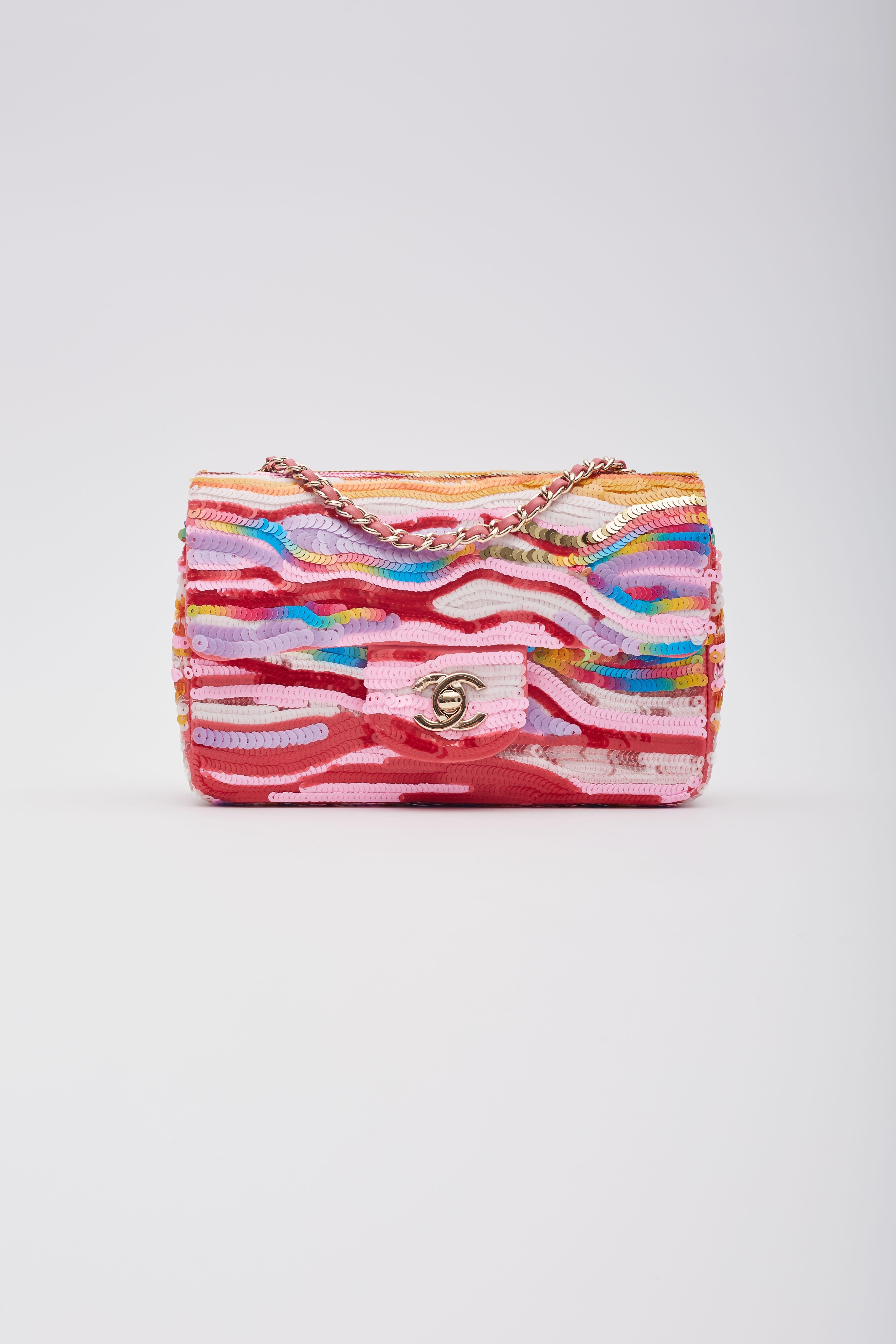Color: pink with multicolour
Material: Sequins
Microchipped bag
Comes with: Dust bag
Condition: Excellent. Bag is pristine and like new.
Made in Italy

Measurements~
Height 6”
Width 10”
Depth 2.5”
Drop: 16.5” (single) & 9.5” (doubled)
Retail.