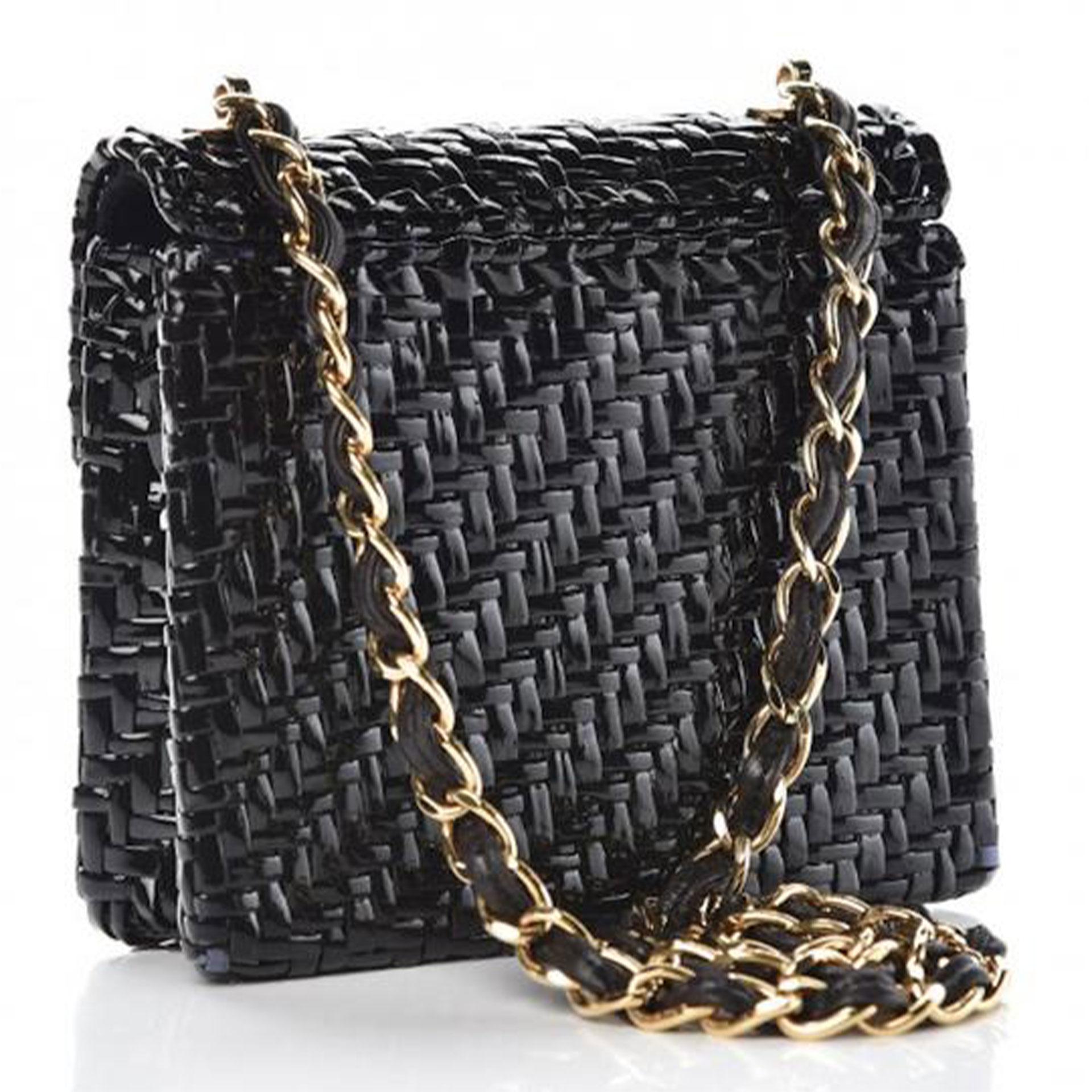 Chanel Flap Vintage Mini Wicker Raffia Classic Black Rattan Cross Body Bag

2001
Gold hardware
Classic interwoven chain

The bag features a long gold chain link shoulder strap threaded with leather and a frontal half flap with a gold Chanel Classic