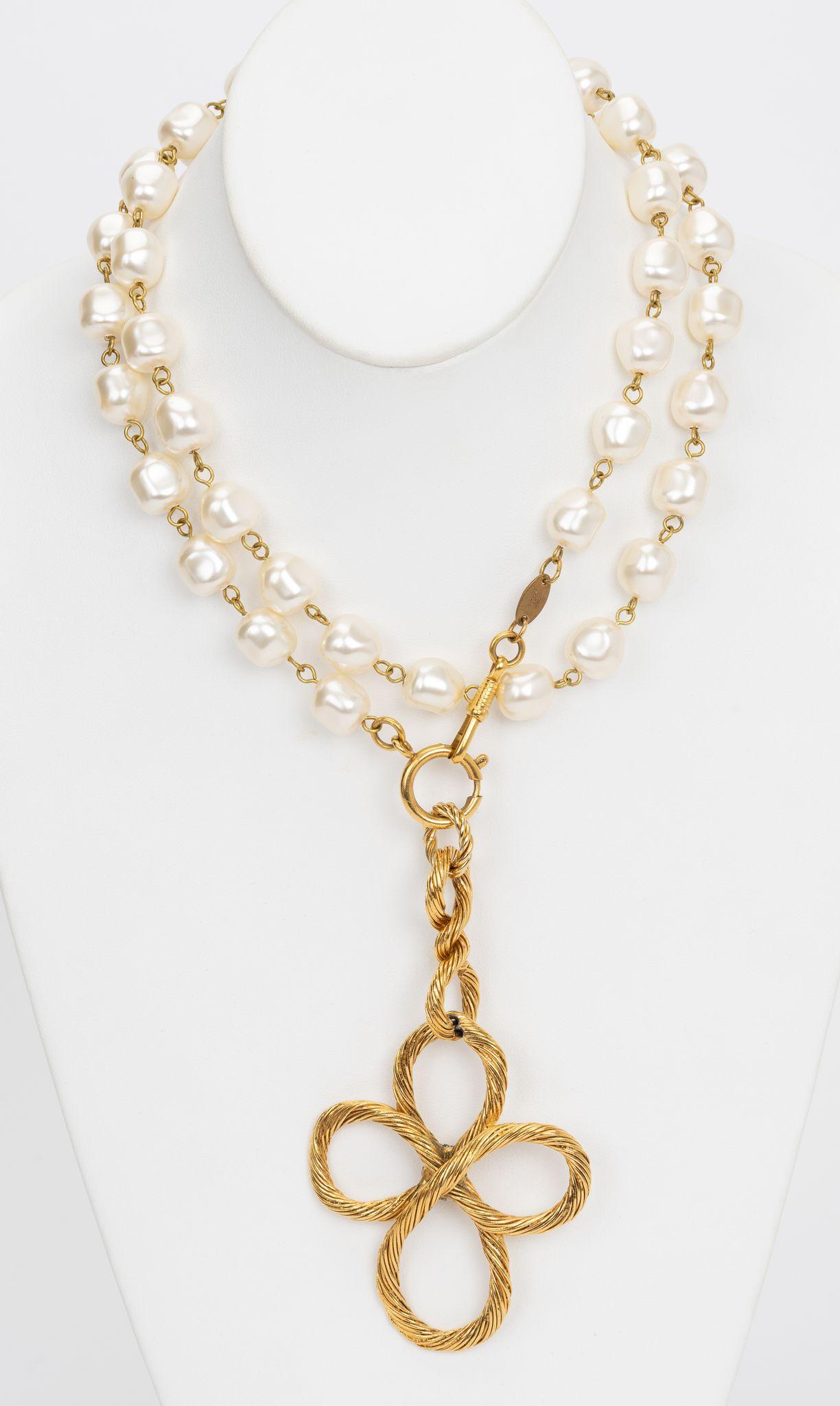 The Chanel Gold Flower pendent hangs from a beautiful pearl chain necklace. 1982 collection as marked on tag. Pearls are made of 
