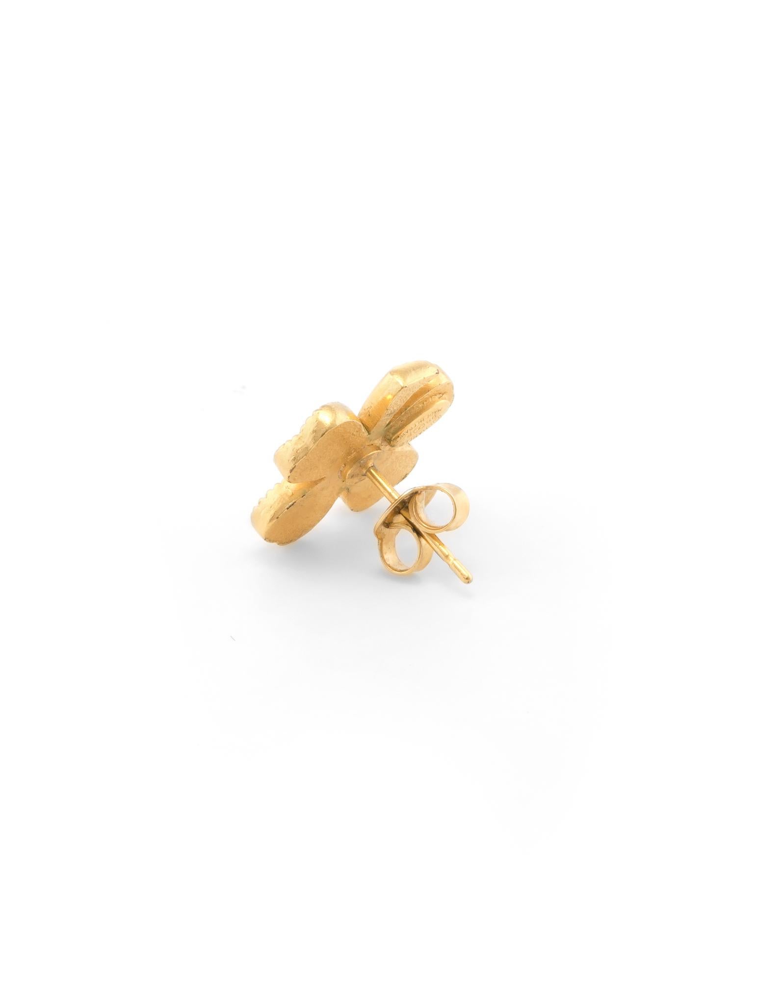 Chanel four leaf clover earrings crafted in yellow gold tone (circa 1998).
 
Five white crystals are set into each leaf. The crystals are in-tact and in good condition. 

The smaller stud earrings are fitted with post and butterfly backings for