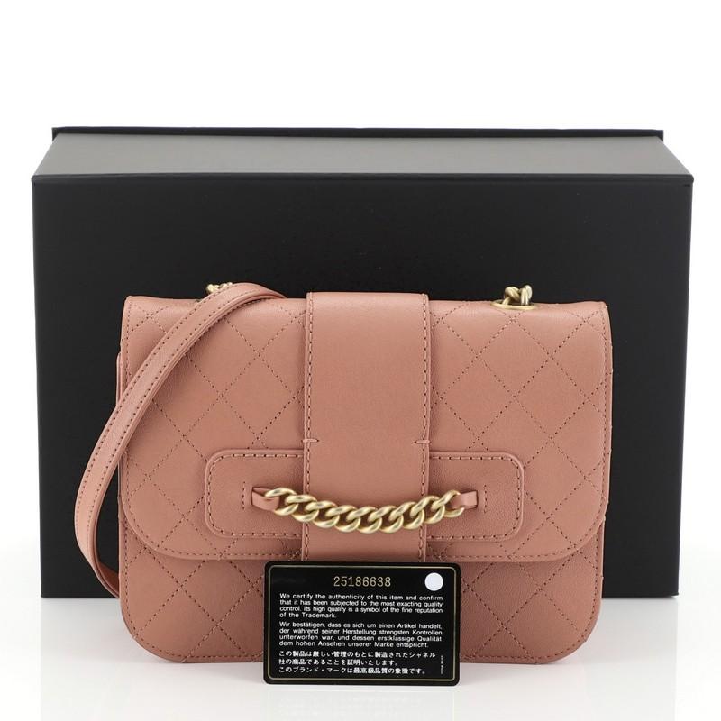 This Chanel Front Chain Flap Bag Quilted Sheepskin Medium, crafted in pink quilted sheepskin, features chain link shoulder strap, front flap with chain detailing and gold-tone hardware. Its turn-lock closure opens to a red fabric interior with zip
