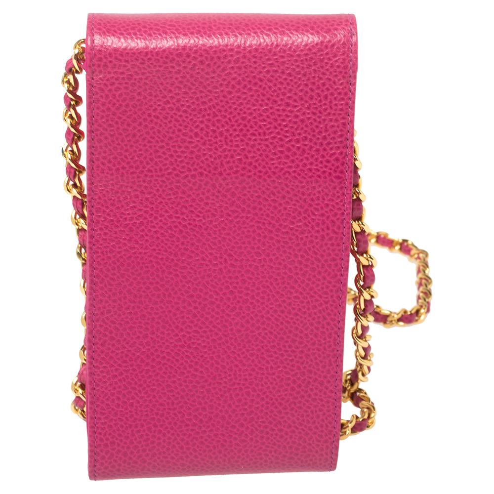 This Chanel phone case is just what you need to complete your overall look. Enhanced with fuchsia color, this stylish creation has a front flap adorned with the CC logo and a crossbody strap.

Includes: Original Box
