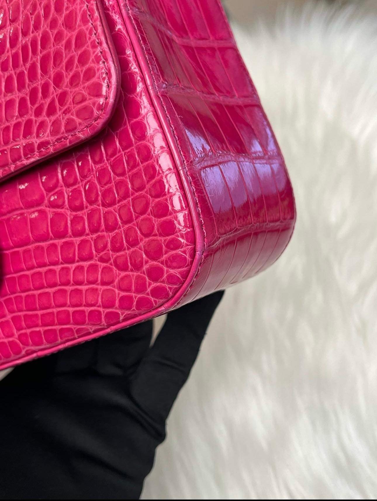 A rare find in hot pink/fuchsia with shiny gold hardware and special metal plaque label inside.
The iconic holy grail bag is the Chanel Classic Flap. Coveted for its simplicity and elegance - single woven chain, turnlock CC clasp, lambskin