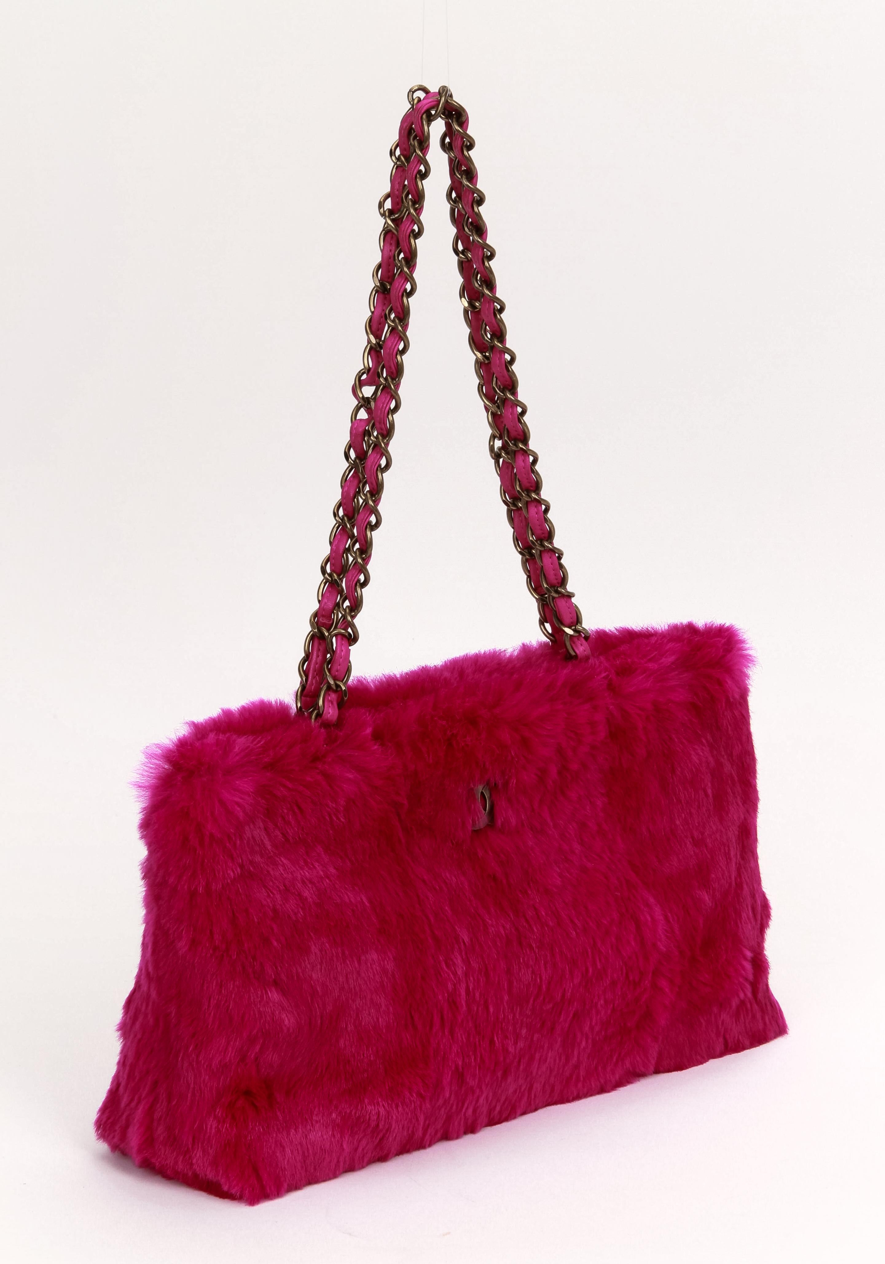 Chanel fuchsia/hot pink rabbit fur shoulder tote with chain straps. Shoulder drop 10