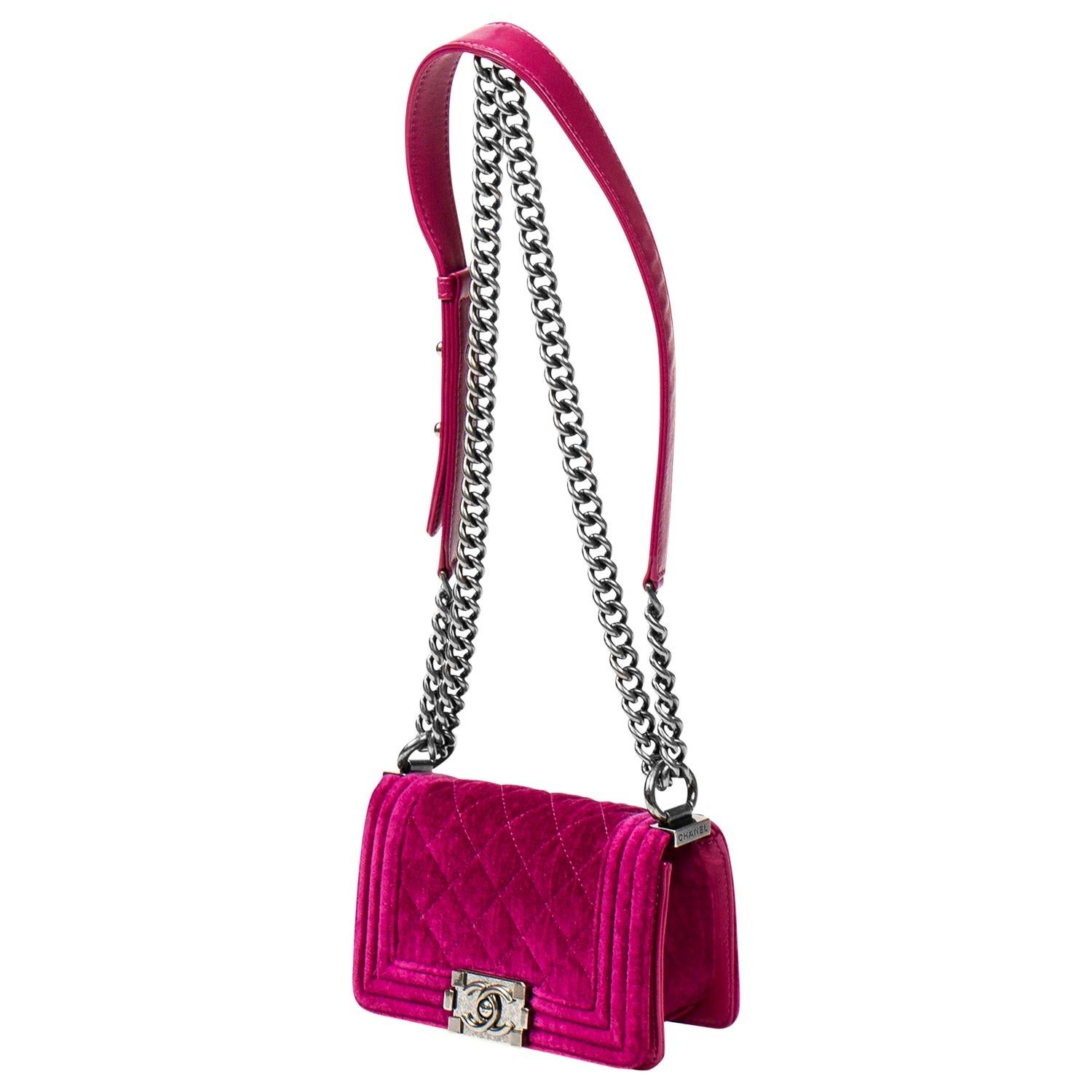 Okay this one is way too cute. Boy Bags were released in 2011 so this is one of the originals by the late Karl Lagerfeld! This iconic and NEVER CARRIED 2012 Chanel mini Boy Bag is rendered in bright pink fuchsia velvet with signature diamond