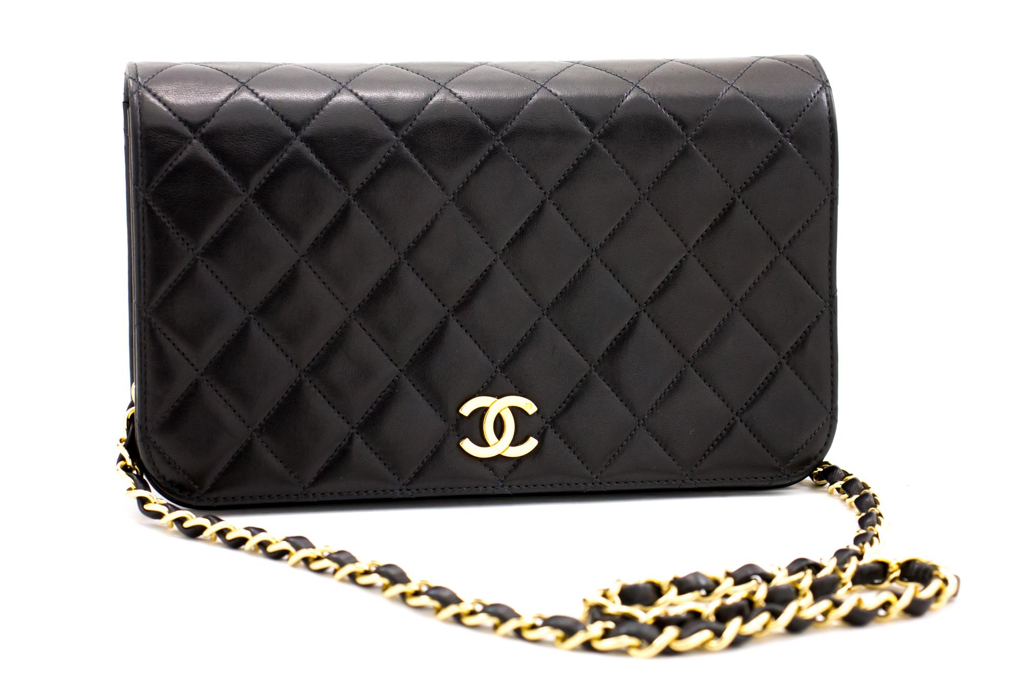 An authentic CHANEL Full Flap Chain Shoulder Bag Clutch Black Quilted made of black Lambskin. The color is Black. The outside material is Leather. The pattern is Solid. This item is Contemporary. The year of manufacture would be 2000-2 0 0 2