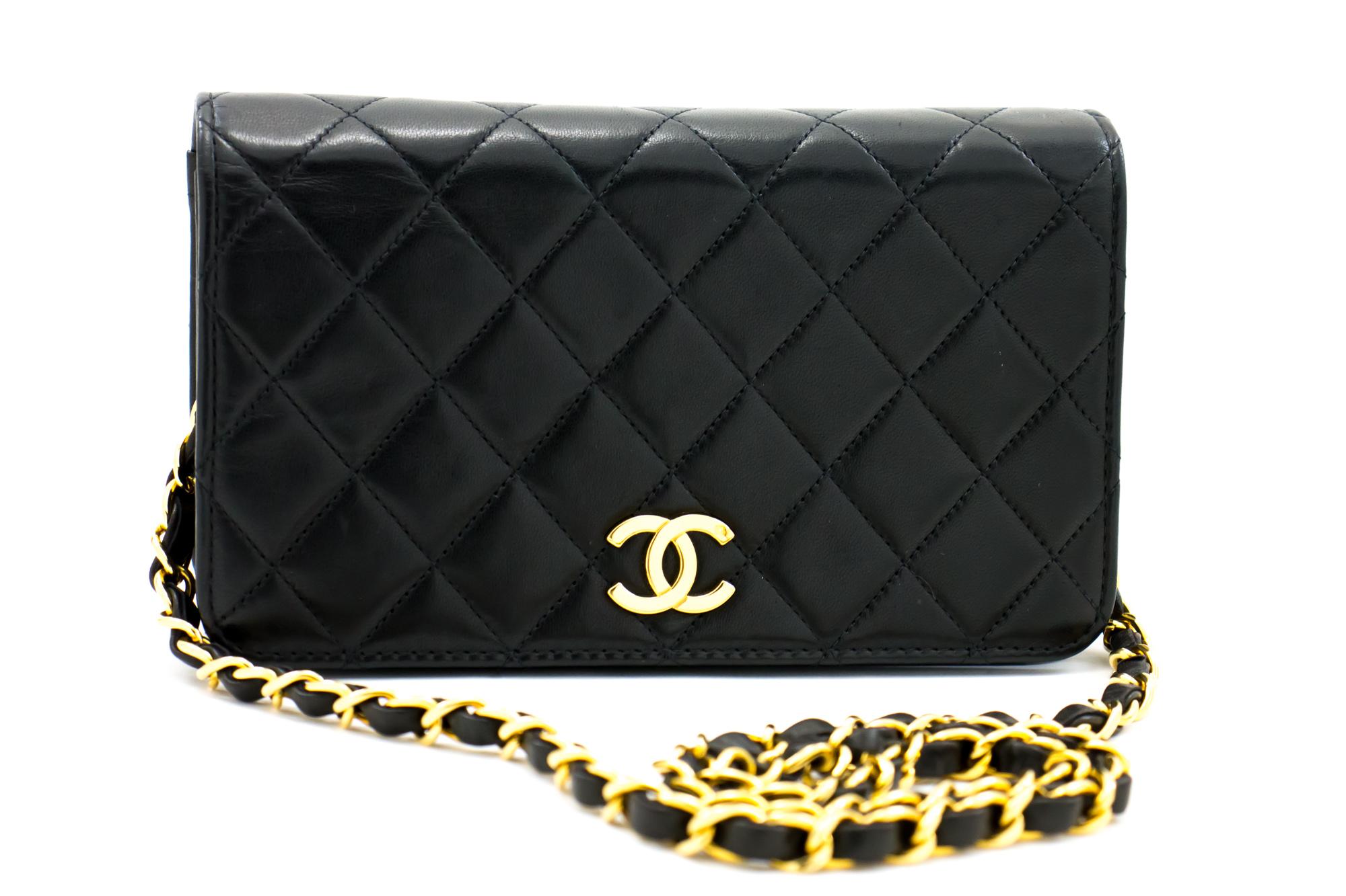 An authentic CHANEL Full Flap Chain Shoulder Bag Clutch Black Quilted made of black Lambskin. The color is Black. The outside material is Leather. The pattern is Solid. This item is Vintage / Classic. The year of manufacture would be