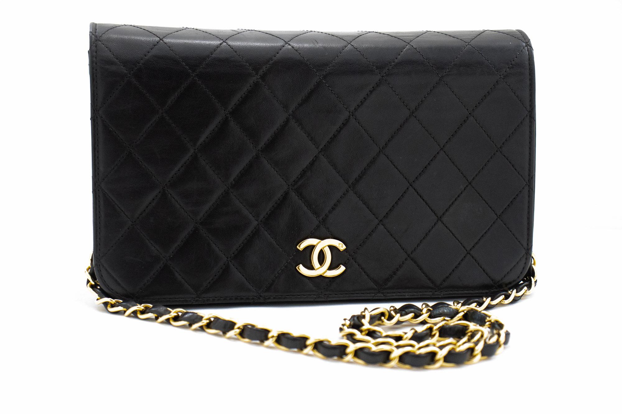 An authentic CHANEL Full Flap Chain Shoulder Bag Clutch Black Quilted made of black Lambskin. The color is Black. The outside material is Leather. The pattern is Solid. This item is Vintage / Classic. The year of manufacture would be