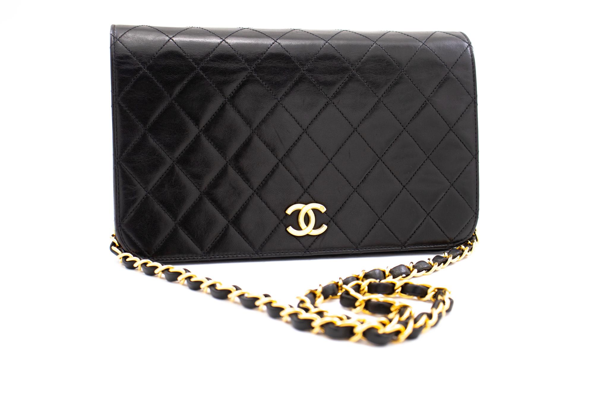 An authentic CHANEL Full Flap Chain Shoulder Bag Clutch Black Quilted made of black Lambskin. The color is Black. The outside material is Leather. The pattern is Solid. This item is Vintage / Classic. The year of manufacture would be