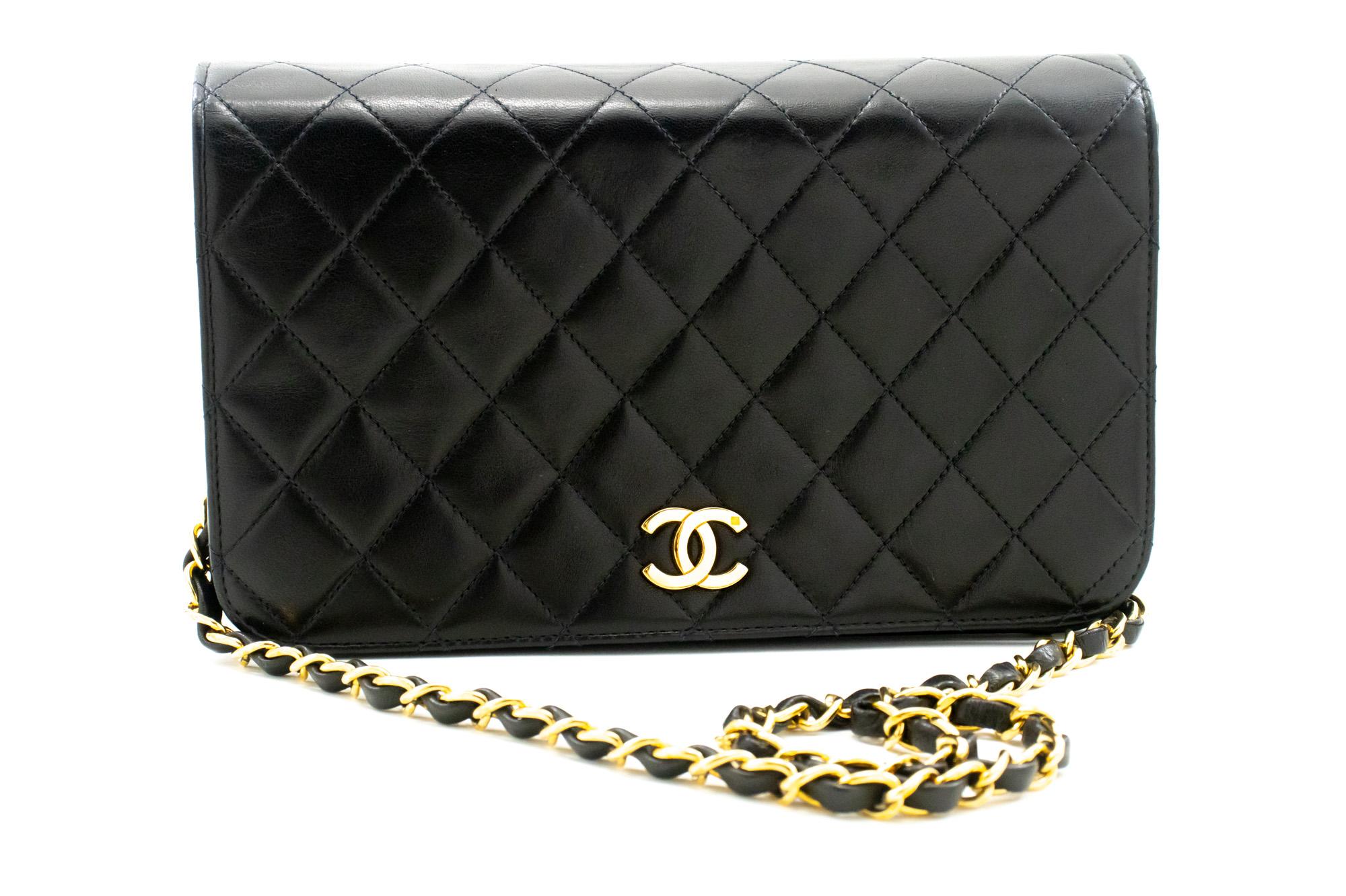 An authentic CHANEL Full Flap Chain Shoulder Bag Clutch Black Quilted made of black Lambskin. The color is Black. The outside material is Leather. The pattern is Solid. This item is Vintage / Classic. The year of manufacture would be