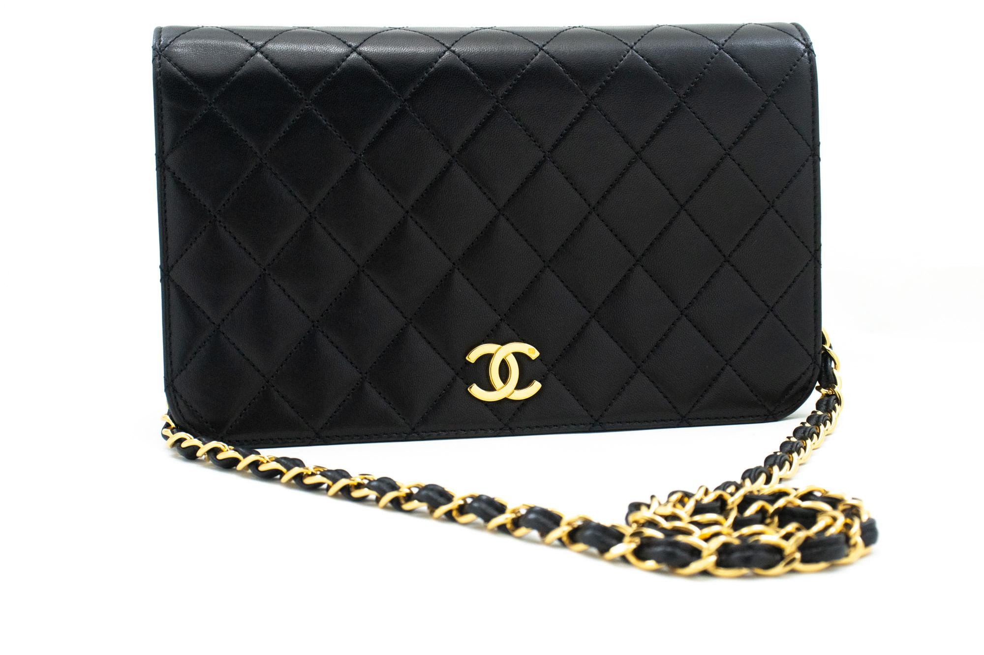 An authentic CHANEL Full Flap Chain Shoulder Bag Clutch Black Quilted made of black Lambskin. The color is Black. The outside material is Leather. The pattern is Solid. This item is Vintage / Classic. The year of manufacture would be