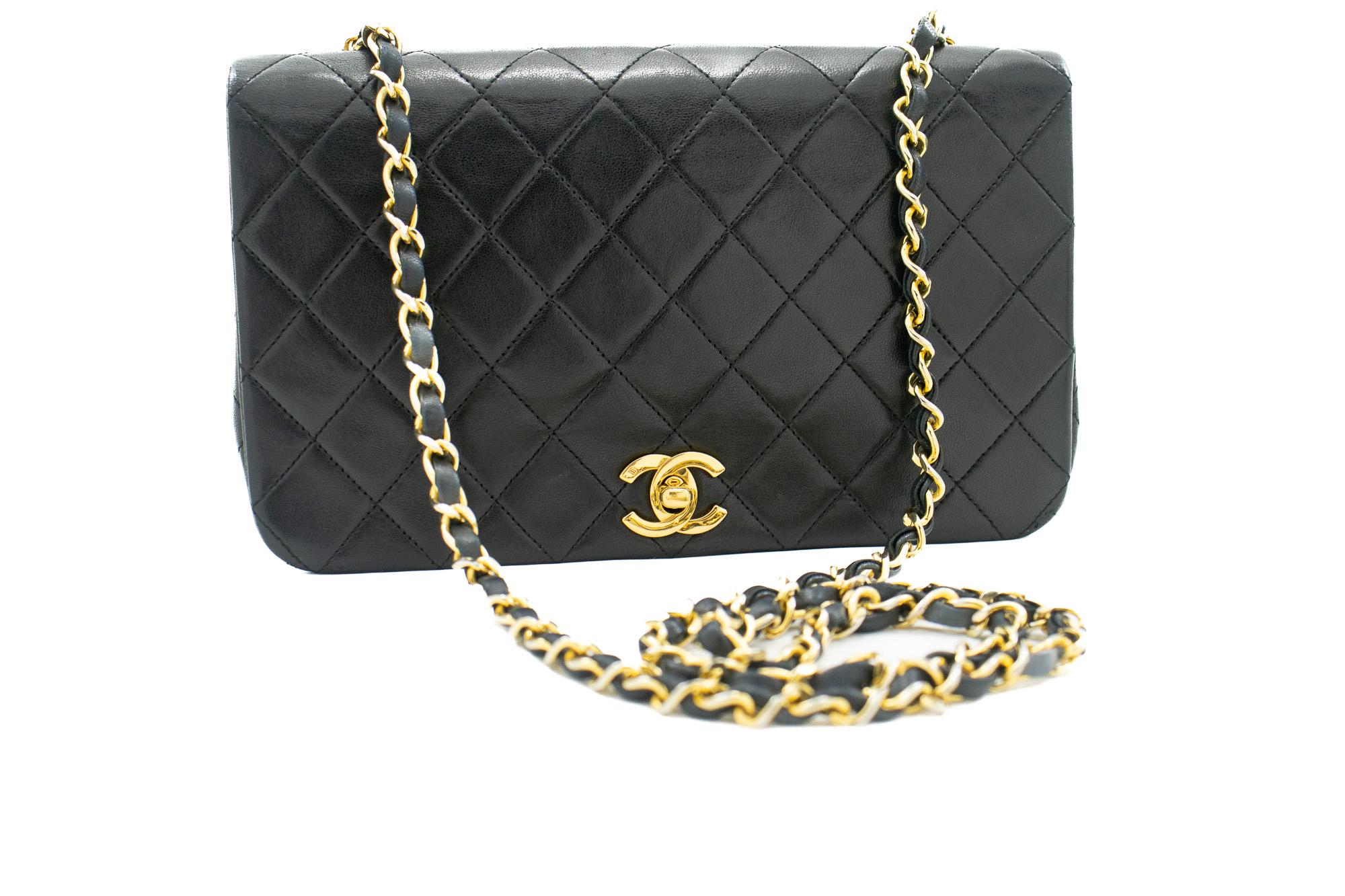 An authentic CHANEL Full Flap Chain Shoulder Bag Black Quilted made of black Lambskin Purse. The color is Black. The outside material is Leather. The pattern is Solid. This item is Vintage / Classic. The year of manufacture would be