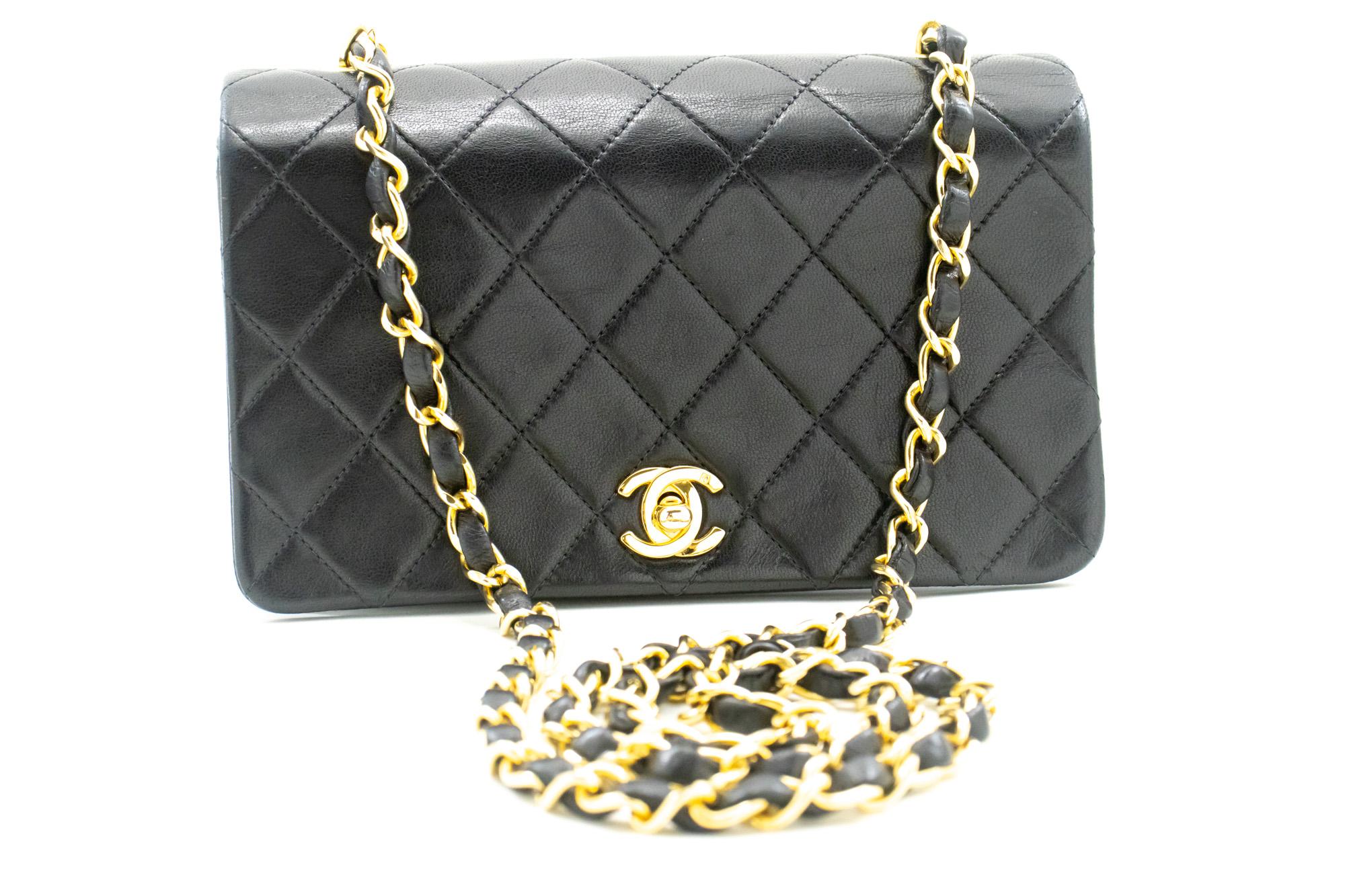 An authentic CHANEL Full Flap Chain Shoulder Bag Crossbody Black made of black Lambskin. The color is Black. The outside material is Leather. The pattern is Solid. This item is Vintage / Classic. The year of manufacture would be