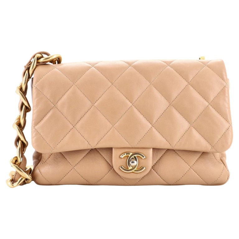 CHANEL 34 cm bag in soft beige quilted leather, matte go…