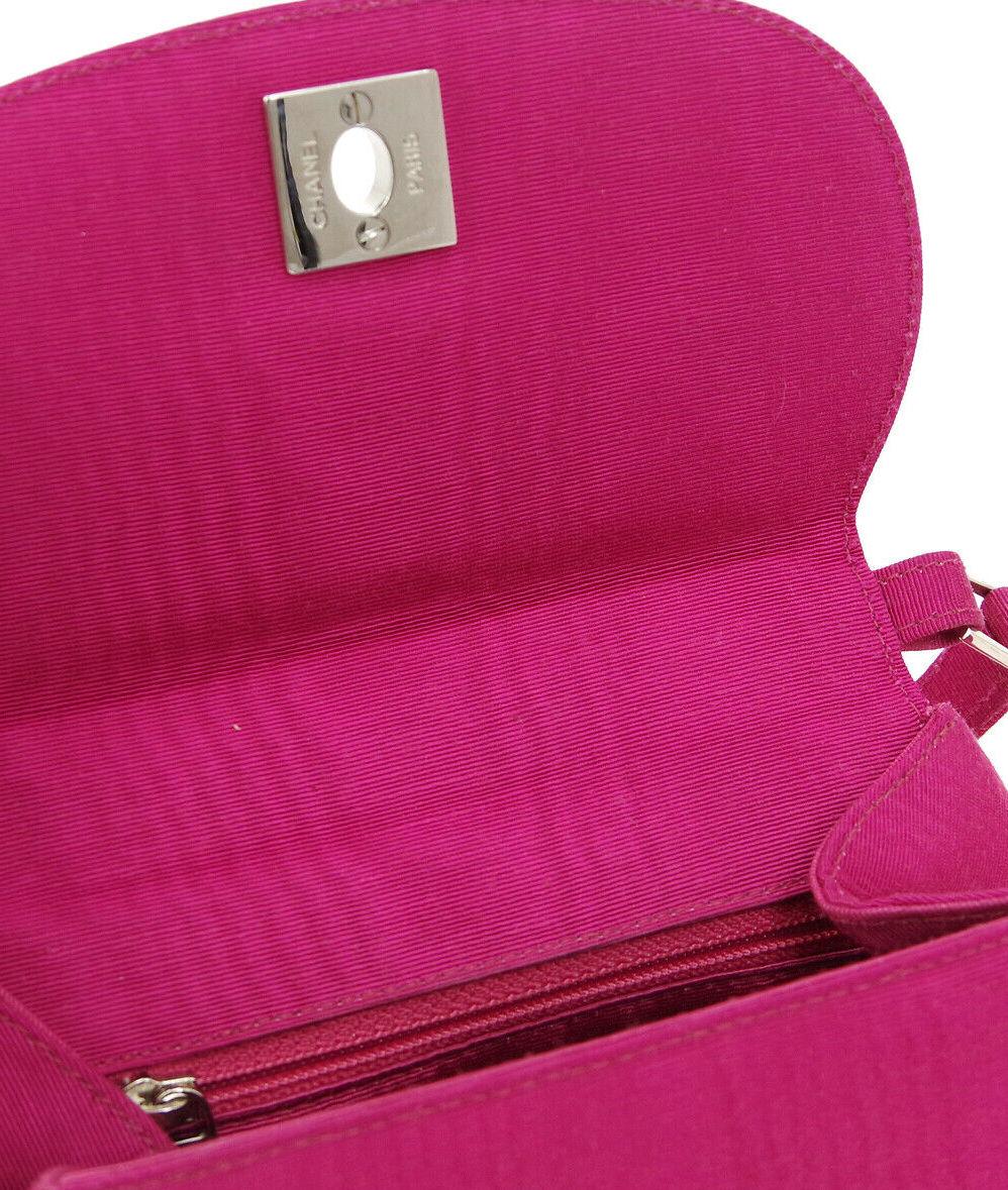 Chanel Fuschia Pink Silver Top Handle Satchel Kelly Style Evening Party Bag

Satin
Silver tone hardware
Made in Italy
Date code present
Handle drop 3